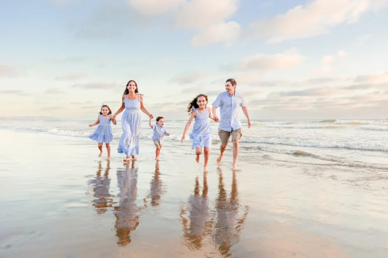 Family Running on the Shore in San Diego
