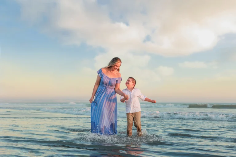 Mother and Son on the Beach laughing and running