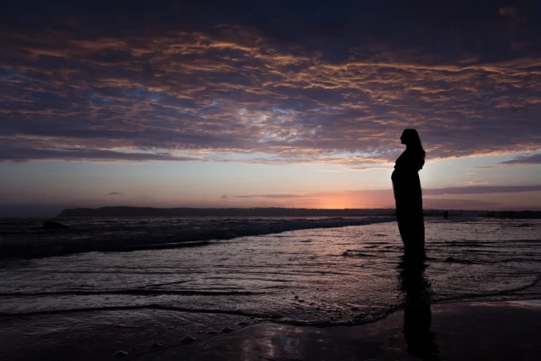 Expectant Mother on the Beach at Sunset