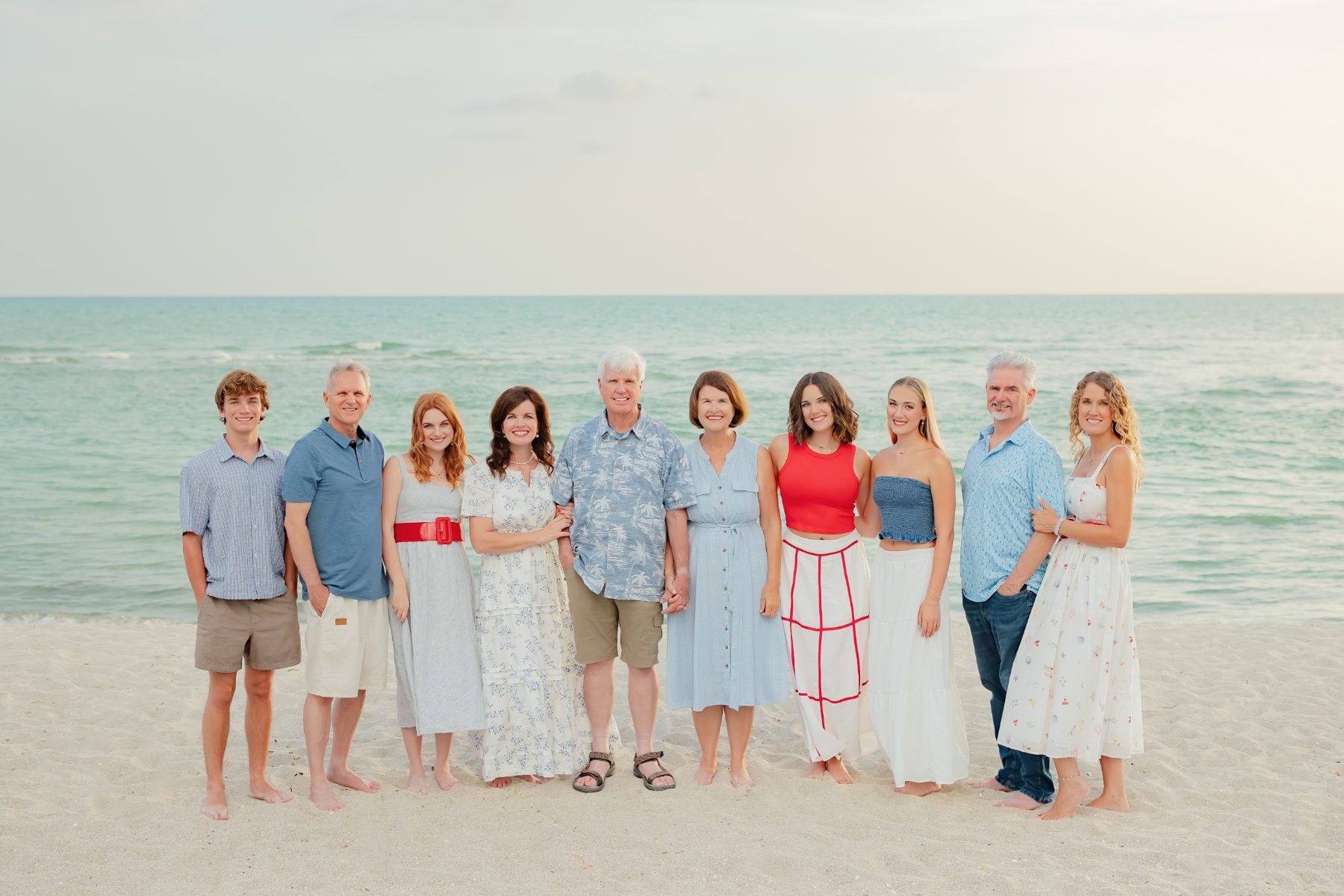 Ten family members pose together on Captiva Island beach
