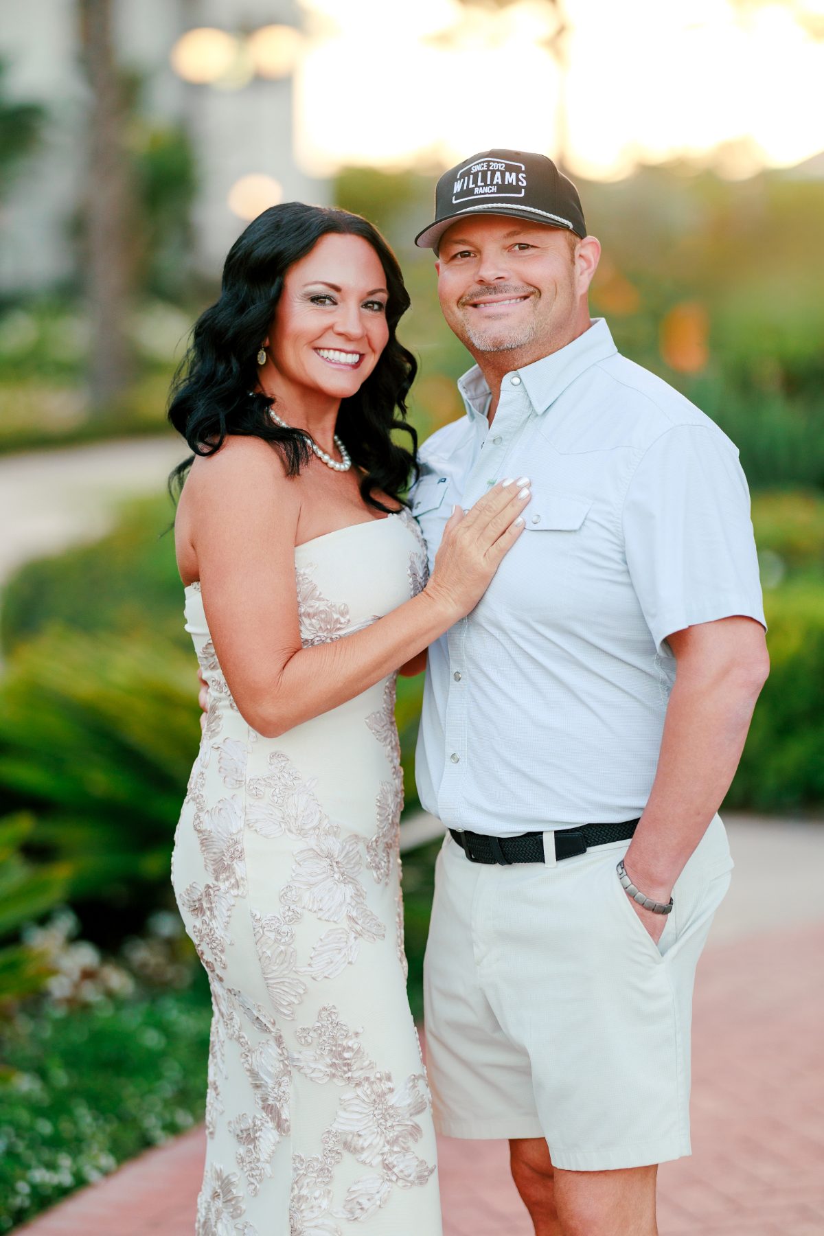 Couple smiling together on garden path at Hotel del Coronado