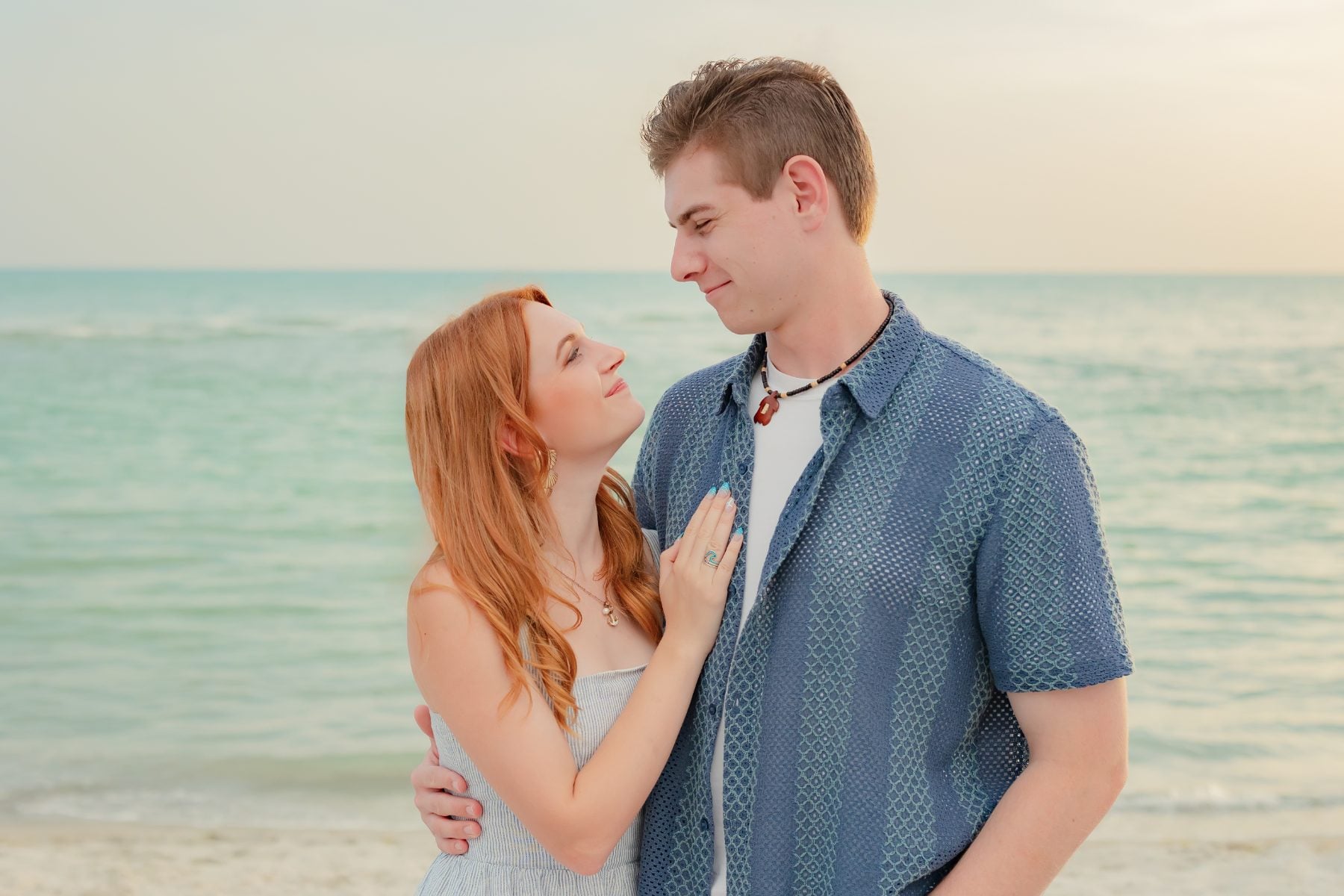 Young couple share a romantic moment on the Captiva Island shoreline