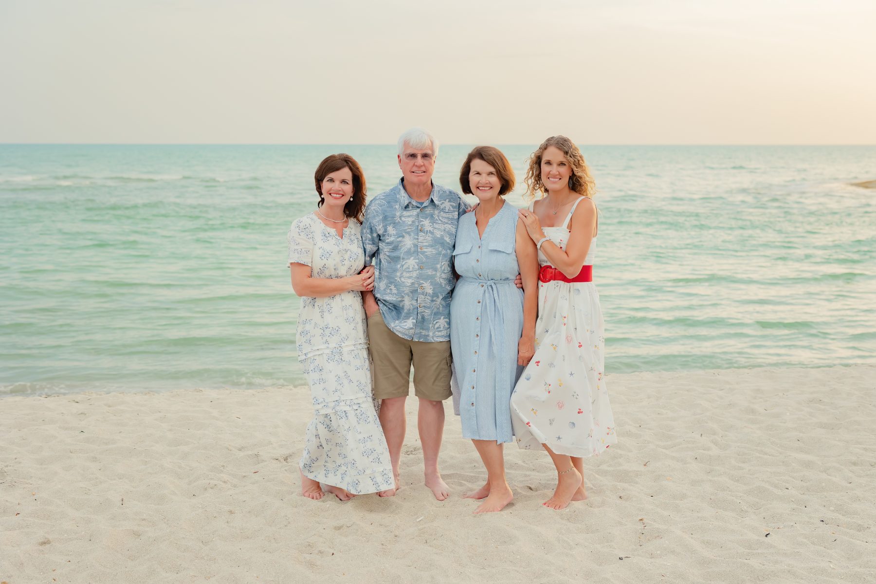 Two daughters and parents gather together for a Sanibel Island portrait