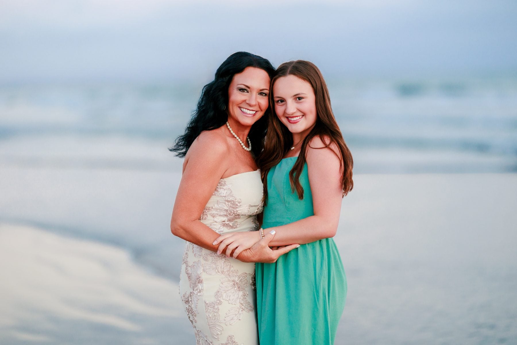 Mother and daughter embrace during Coronado Beach family photos