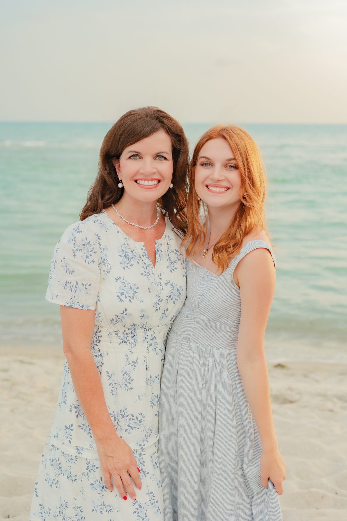 Mother and daughter smiling together on the beach, Captiva Island reunion