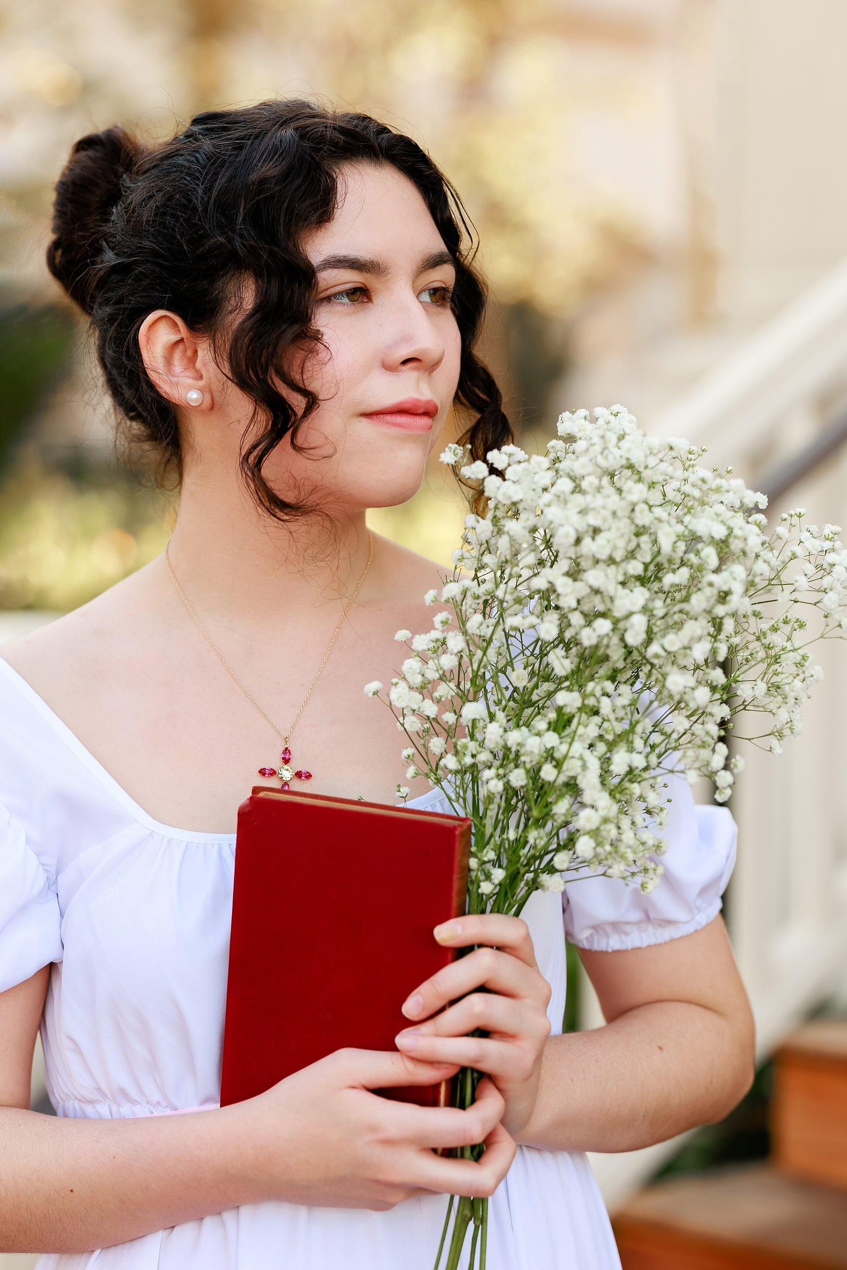 Amanda Fagan’s Love, Jane — 02 Woman holding baby's breath bouquet and red journal in updo hairstyle