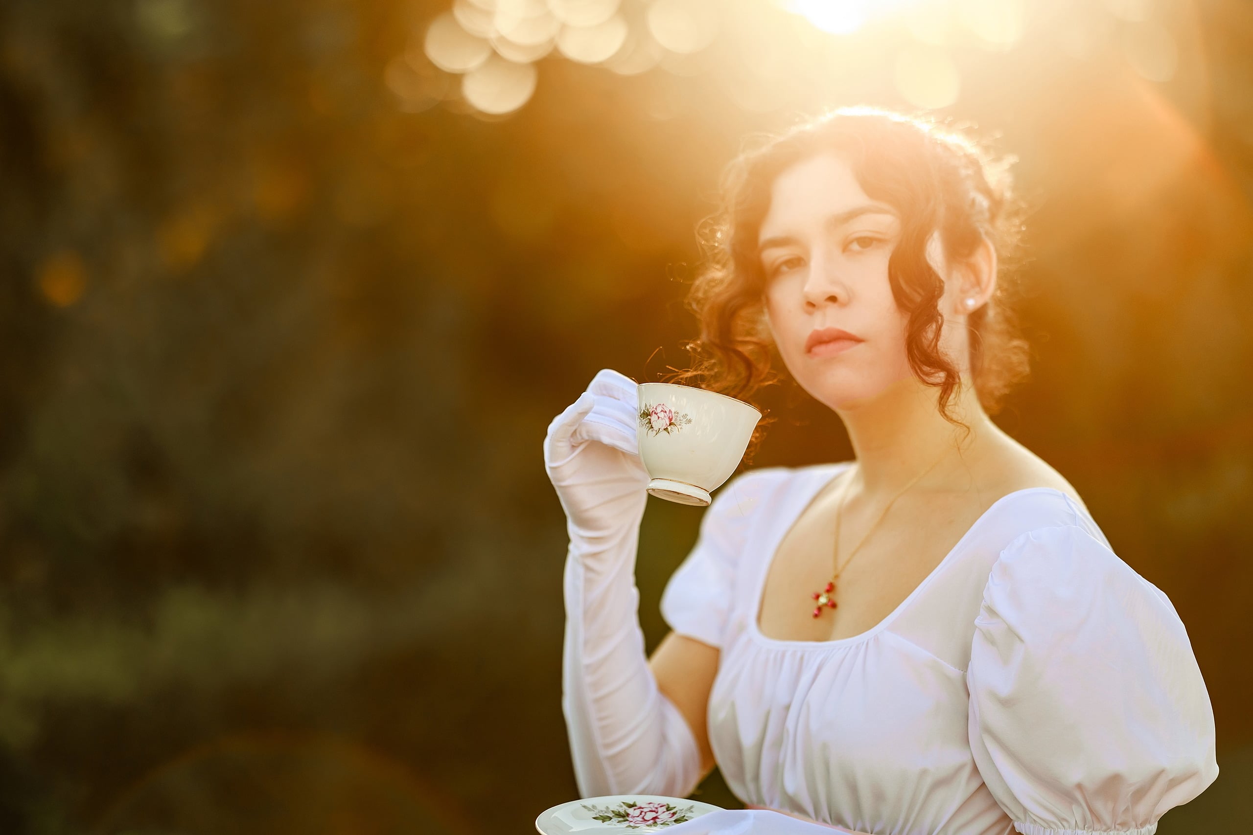 Amanda Fagan’s Love, Jane — 09 Woman in white dress holding embroidered handkerchief at golden hour