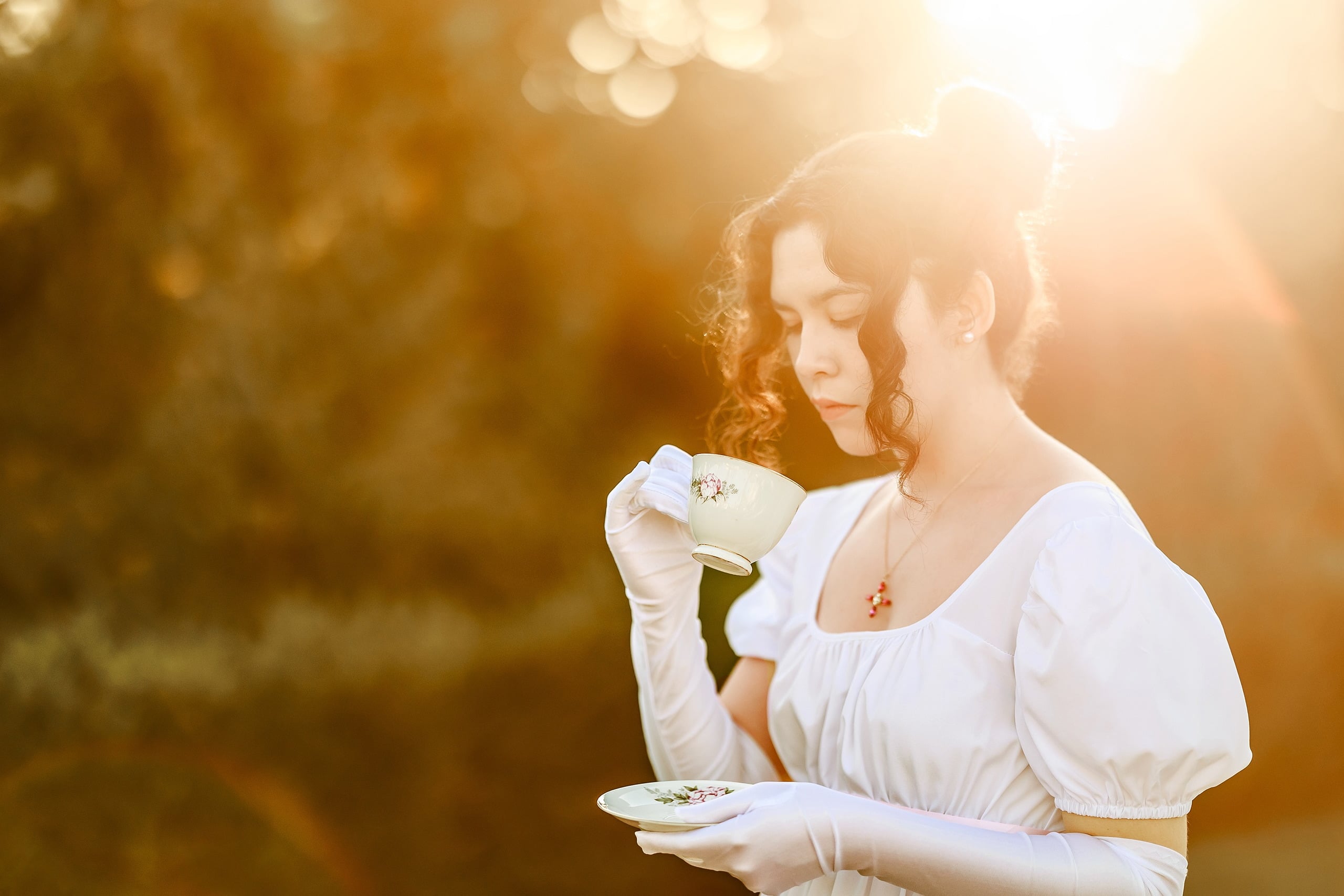Amanda Fagan’s Love, Jane — 11 Two women in white dresses, one holding handkerchief, backlit at golden hour