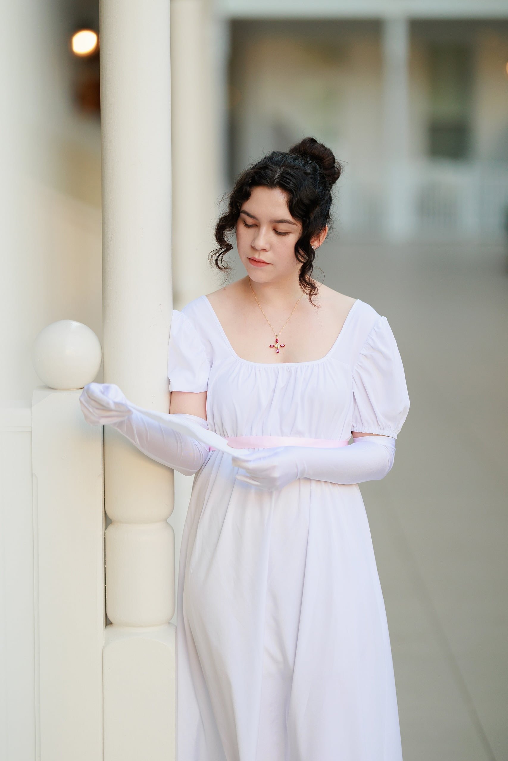 Amanda Fagan’s Love, Jane — 12 Woman in white dress wearing long gloves leaning against white hotel pillar