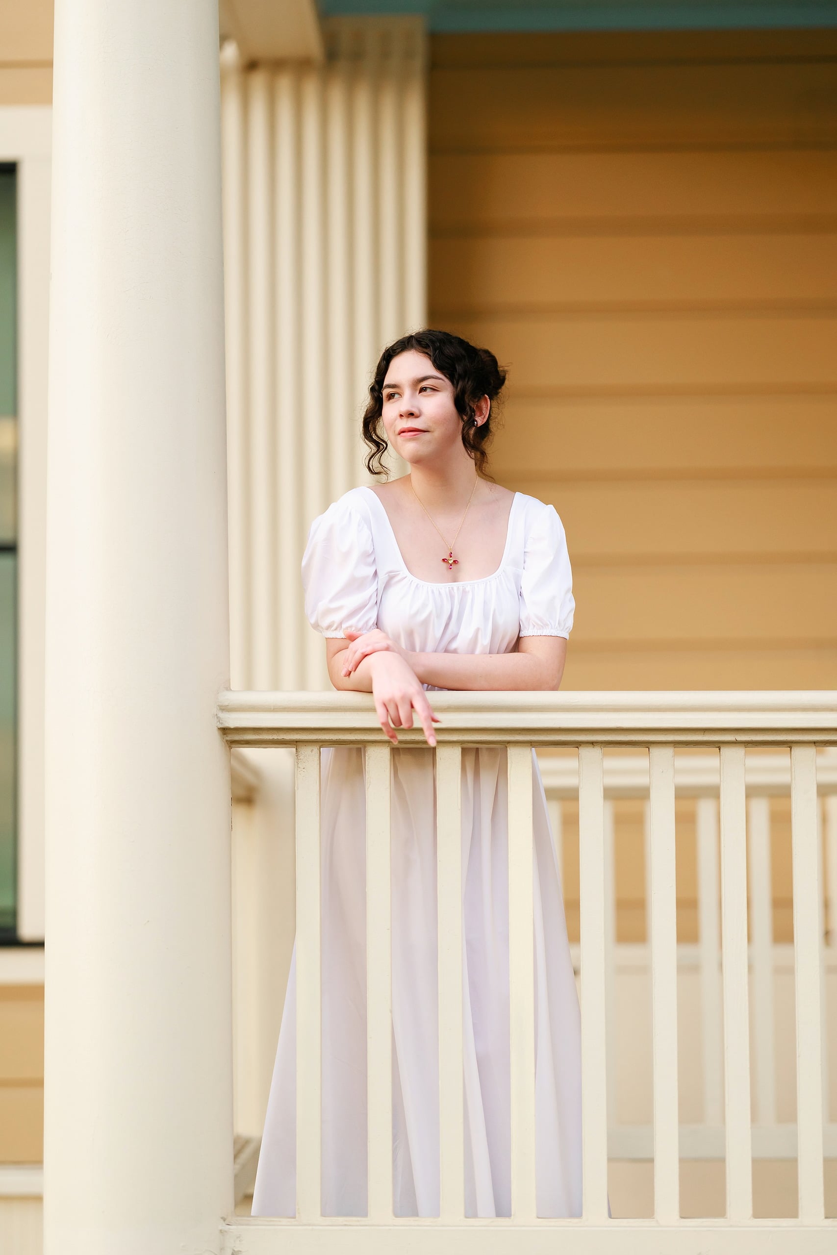 Amanda Fagan’s Love, Jane — 21 Woman in white dress leaning against white pillar in Hotel del Coronado interior