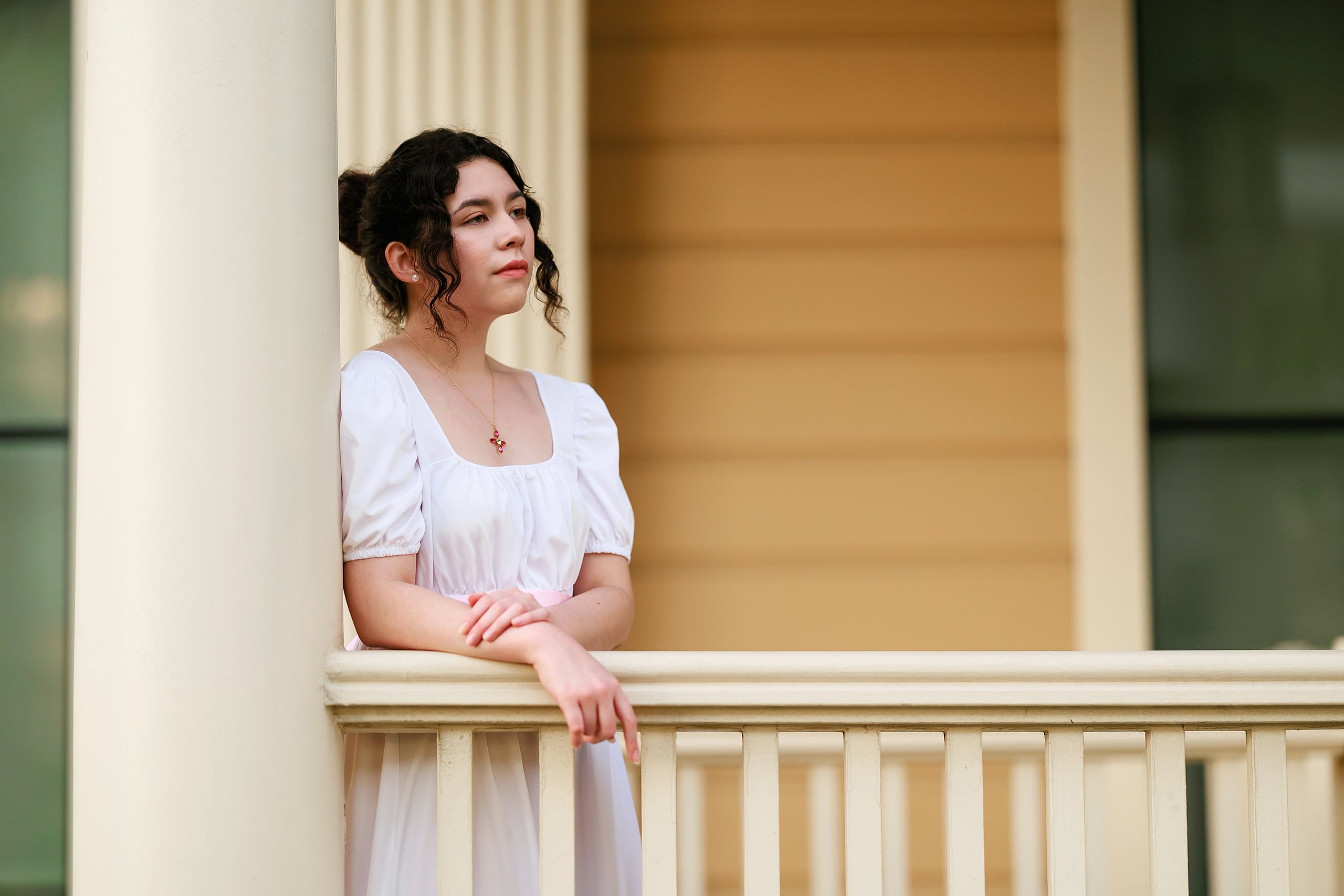 Amanda Fagan’s Love, Jane — 24 Woman in white dress at Hotel del Coronado balcony railing, looking back