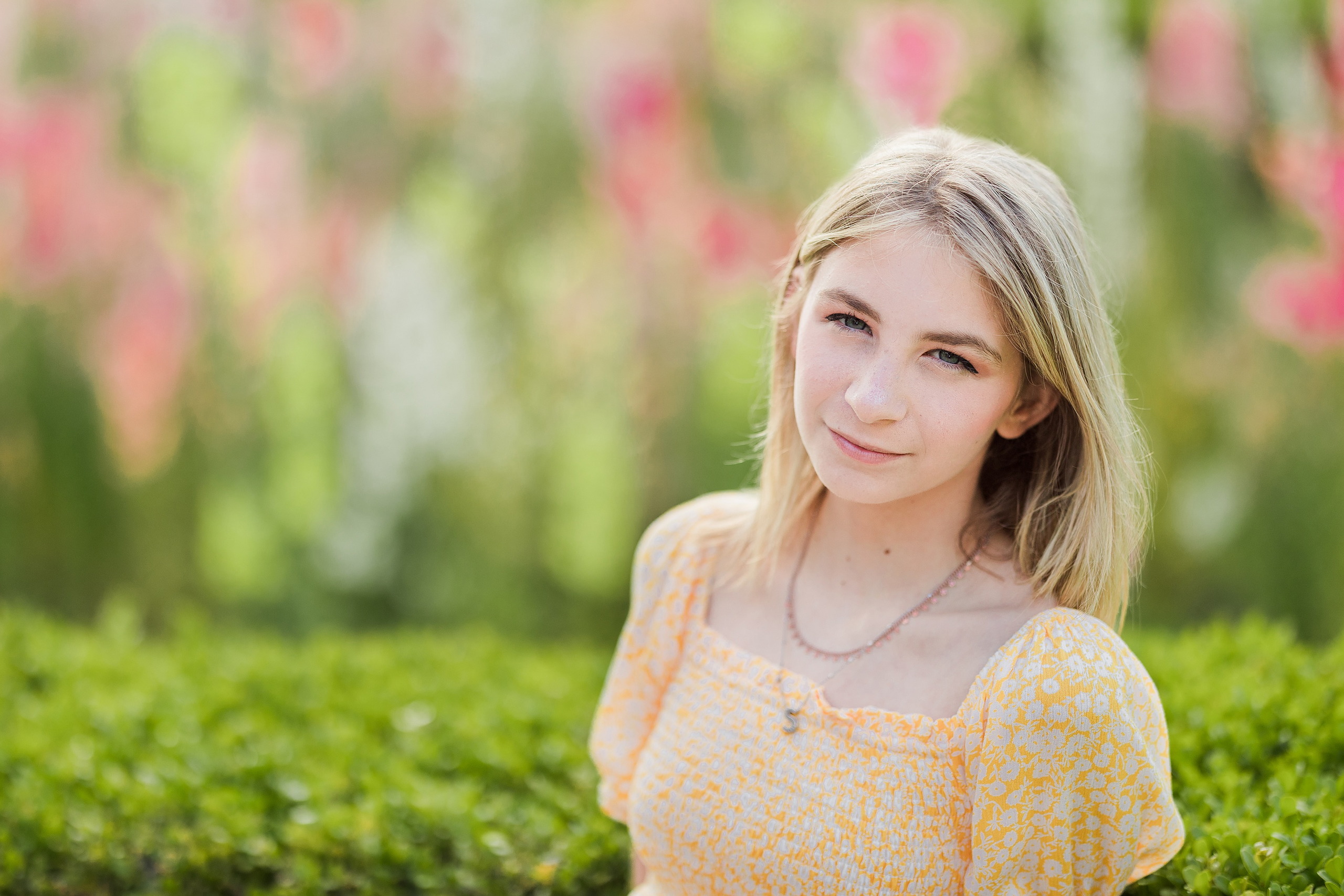 Balboa Park Family Portraits San Diego — 06 Sophie and woman sitting together on ledge with flowers at Balboa Park