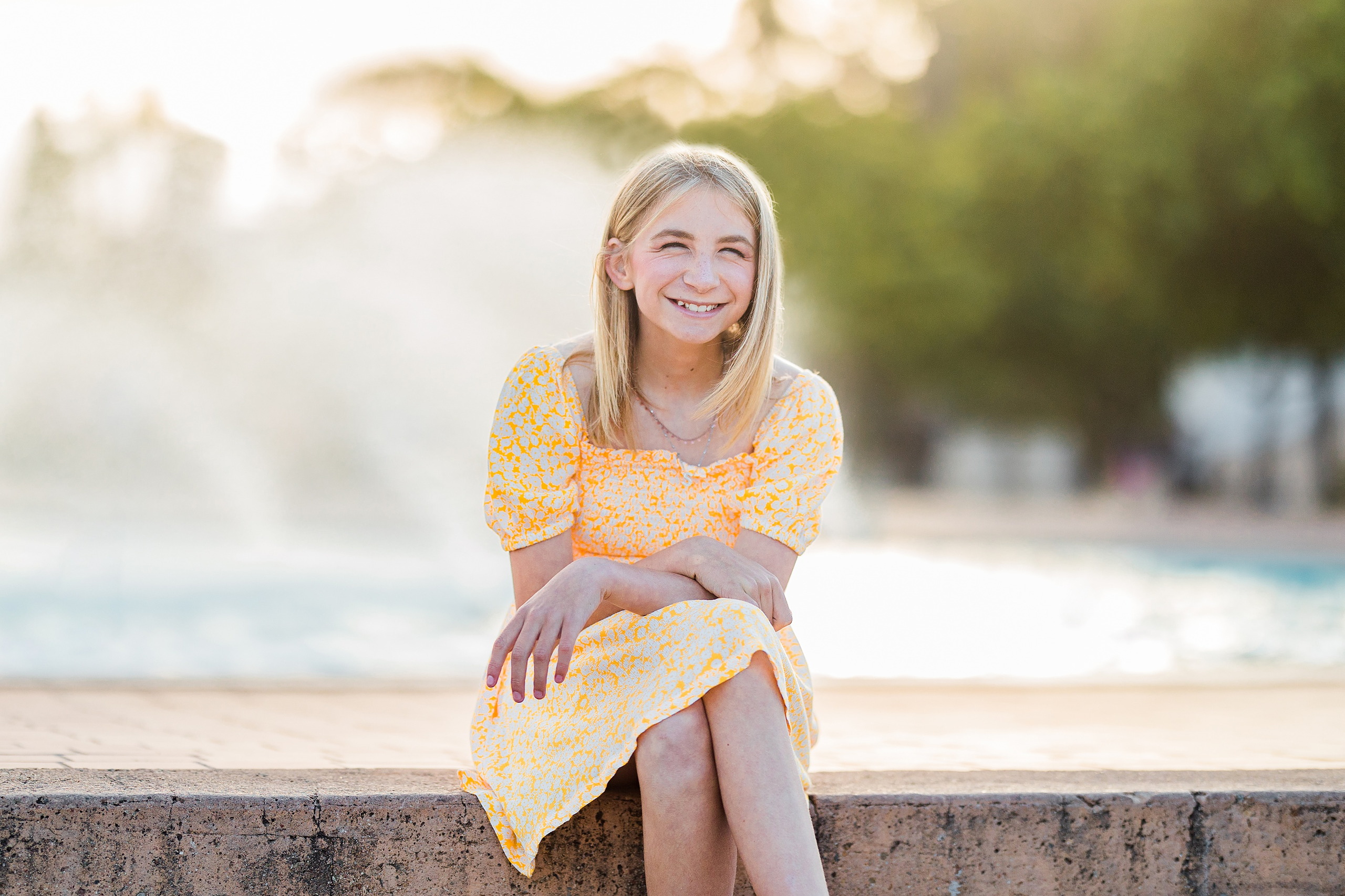 Balboa Park Family Portraits San Diego — 13 Teen girl's portrait with colorful flowers blurred behind at Balboa Park