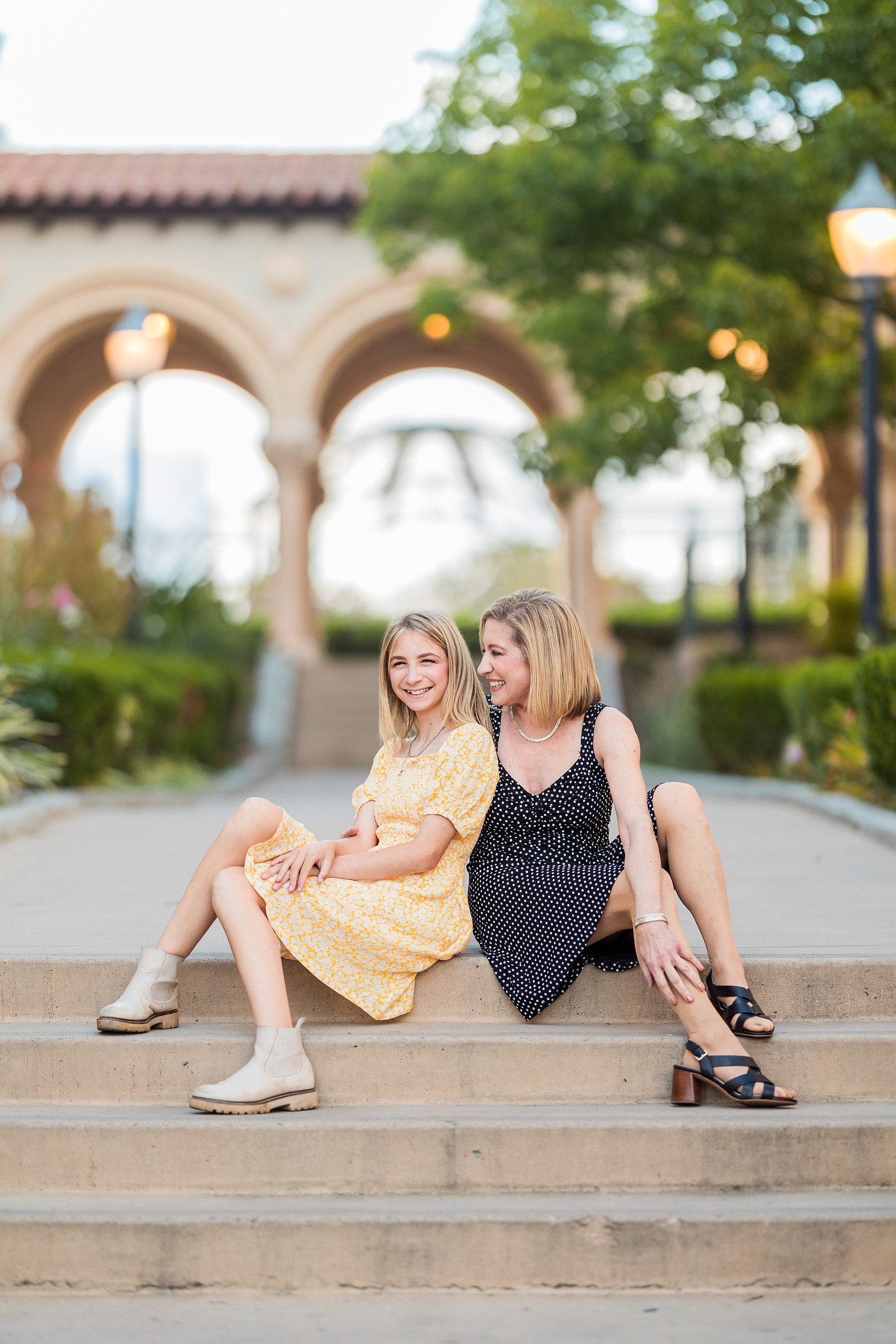 Balboa Park Family Portraits San Diego — 15 Sophie reaching toward blooming yellow roses in gardens at Balboa Park