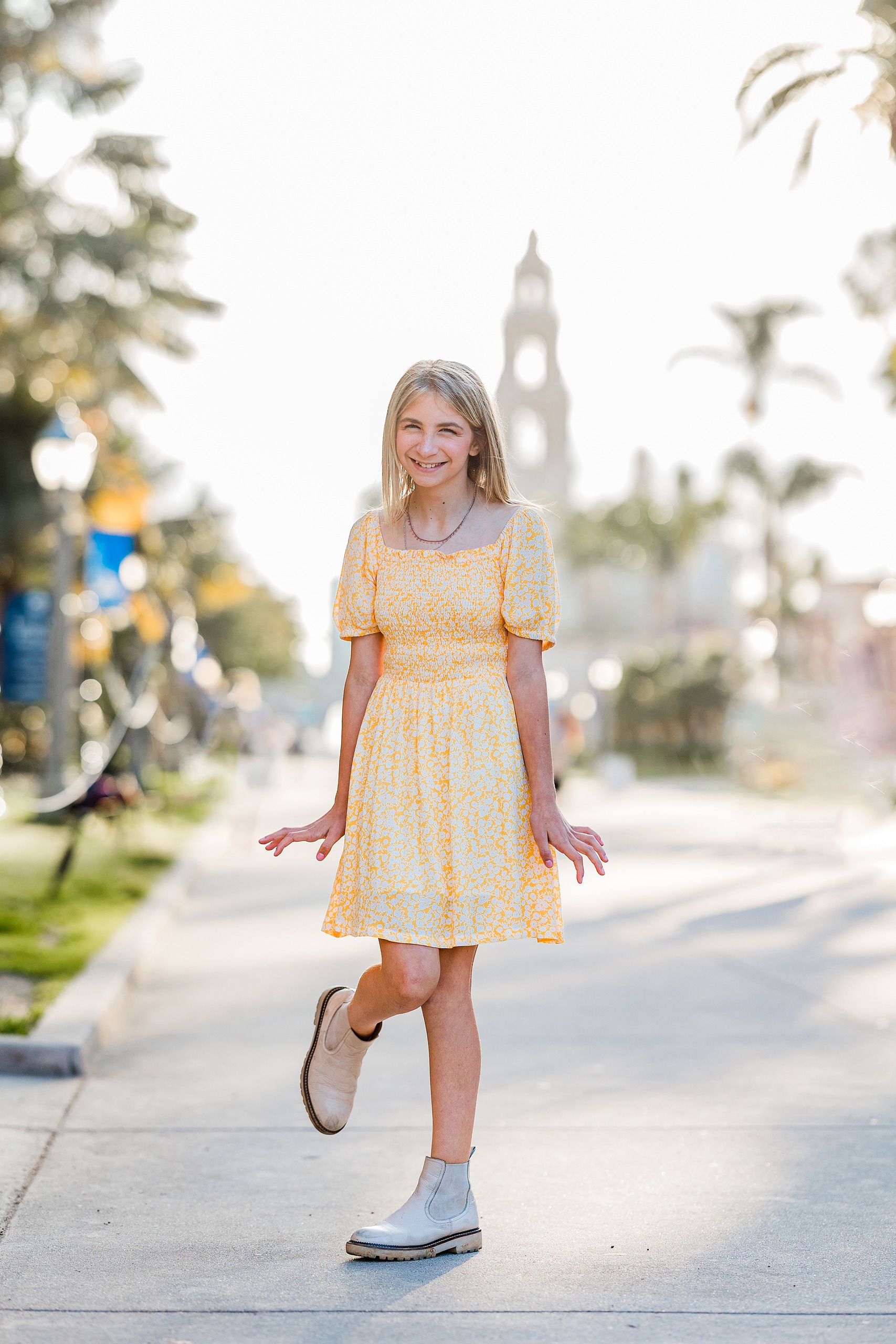 Balboa Park Family Portraits San Diego — 16 Teen girl smiling with flowers and trees all around at Balboa Park