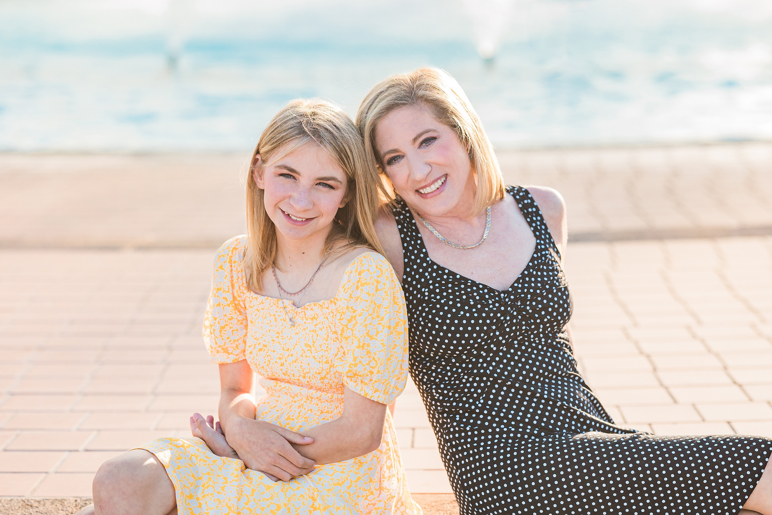 Balboa Park Family Portraits San Diego — 17 Sophie and her mom on grass amid yellow rose bushes at Balboa Park
