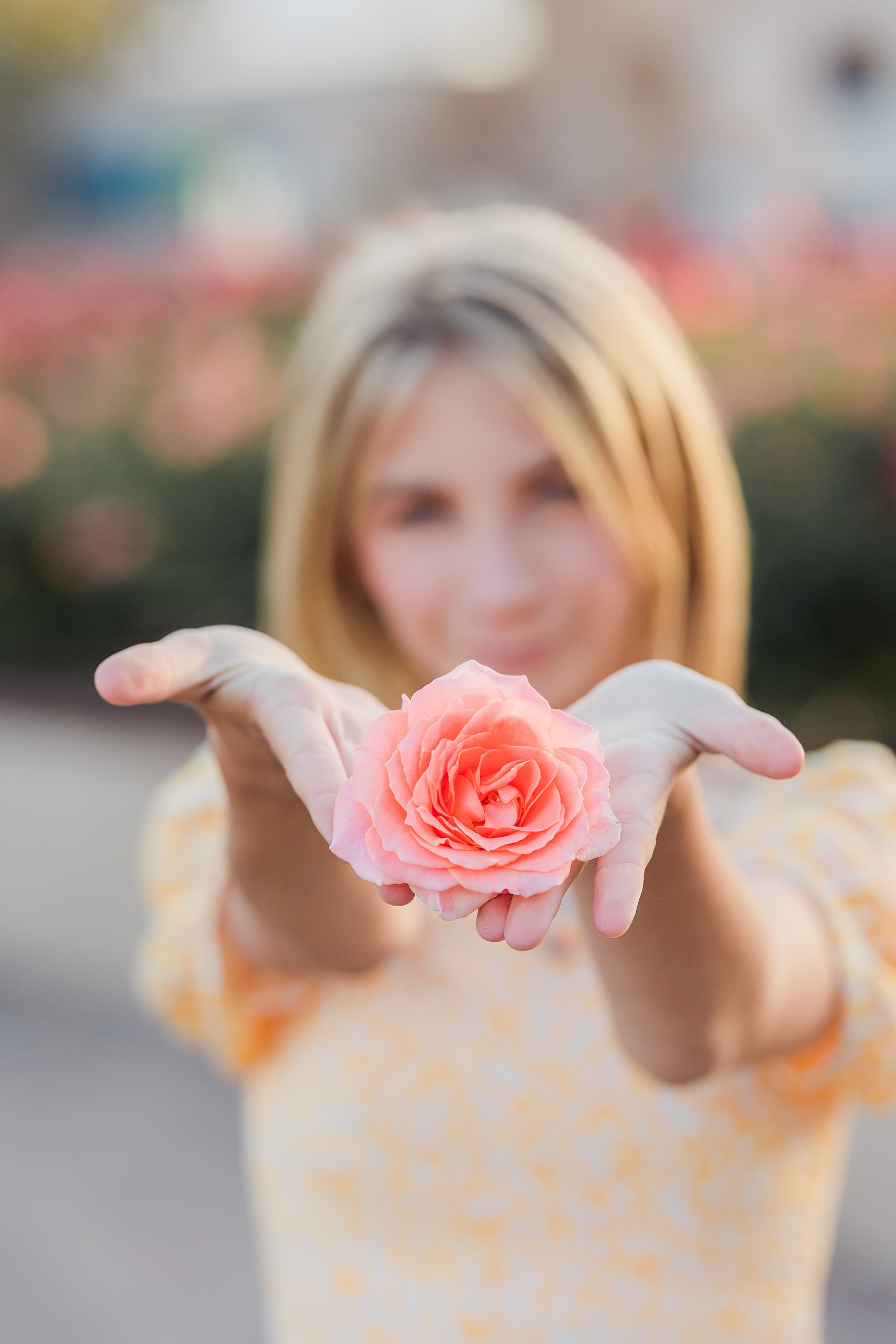 Balboa Park Family Portraits San Diego — 19 Teen girl's face amid blooming pink and coral flowers at Balboa Park