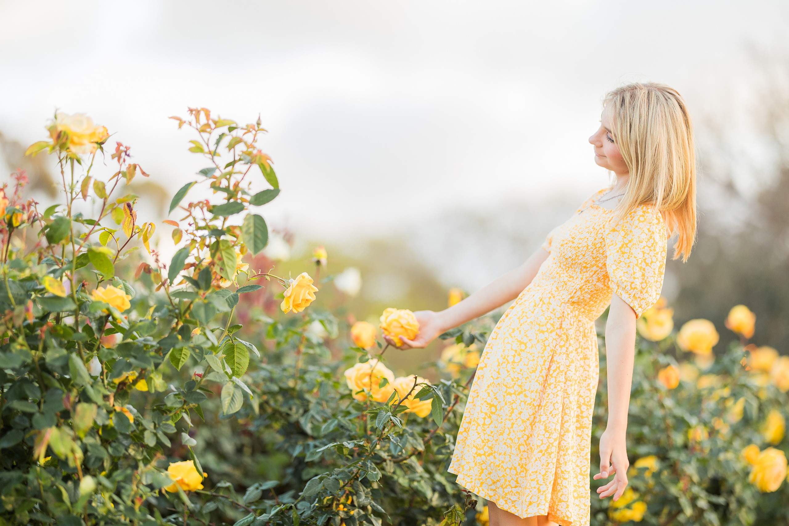 Balboa Park Family Portraits San Diego — 21 Sophie in yellow dress before Spanish colonial building at Balboa Park