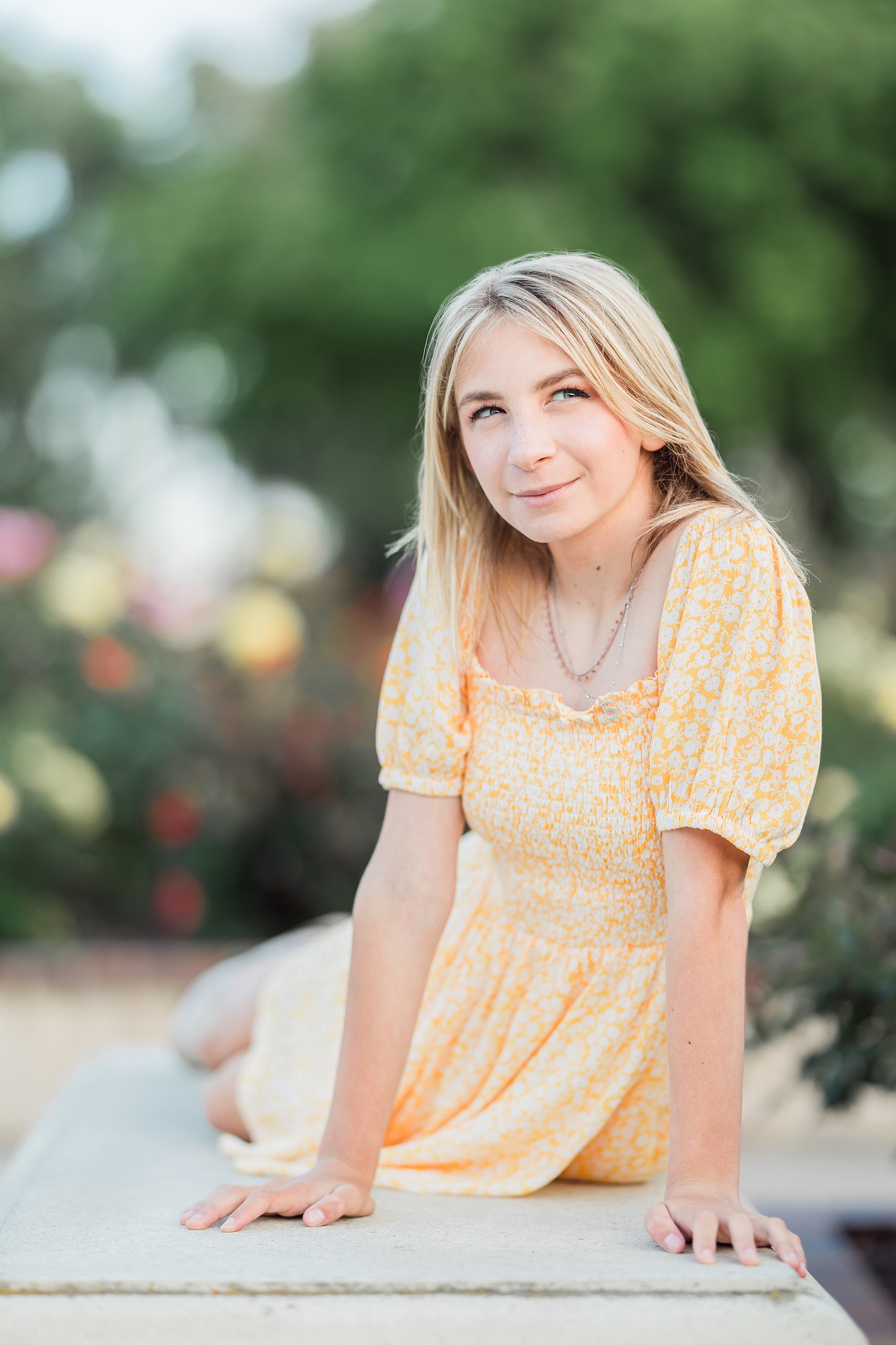 Balboa Park Family Portraits San Diego — 23 Sophie with arms raised releasing flower petals at Balboa Park