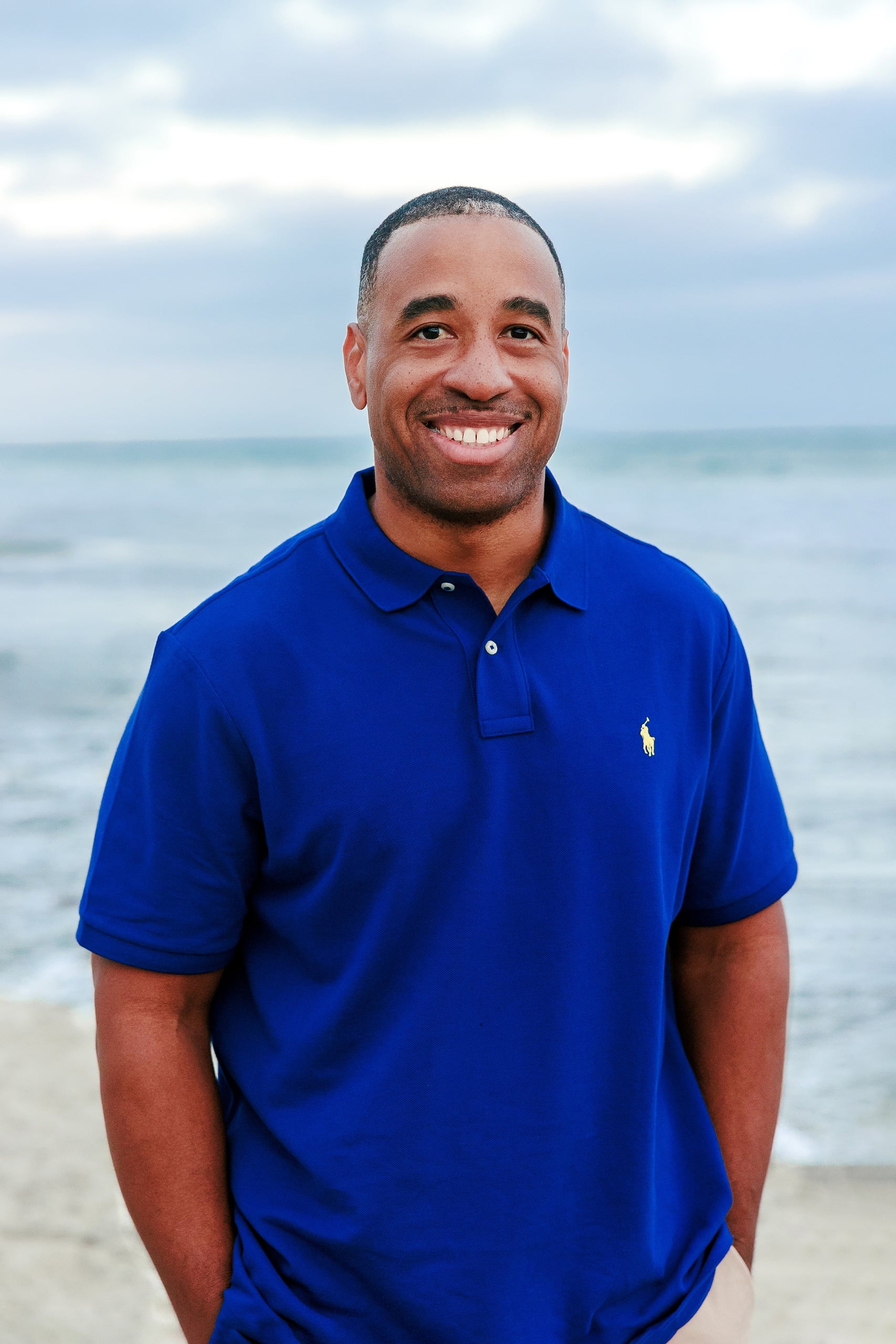 Because Time Flies: Family Photos on Coronado — 09 Dion smiles for a portrait with the ocean behind him on Coronado