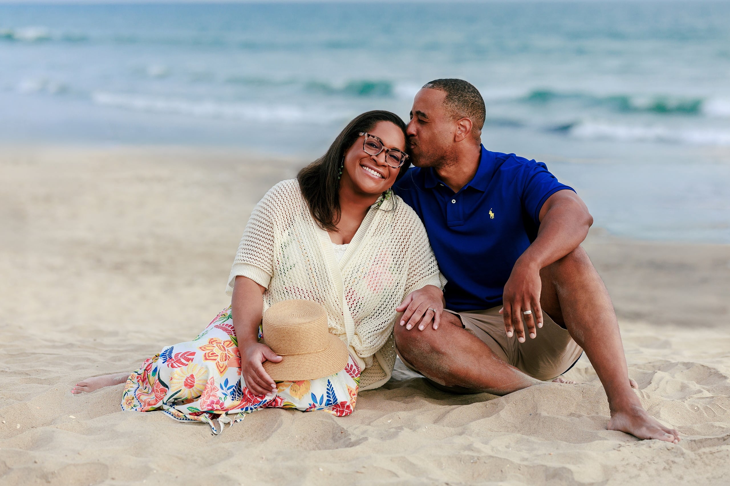 Because Time Flies: Family Photos on Coronado — 11 Michelle and Dion sit close together on Coronado beach with ocean behind