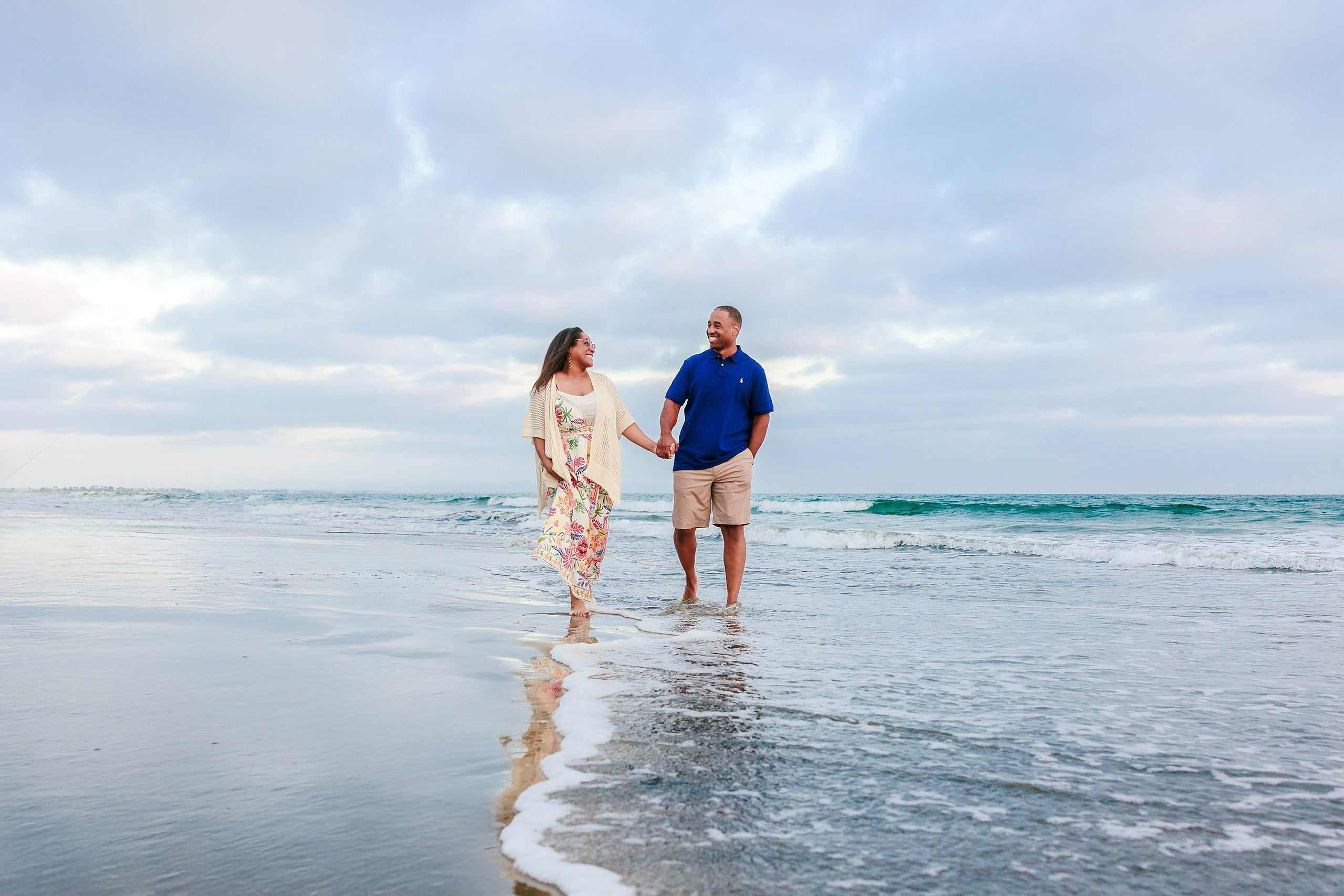 Because Time Flies: Family Photos on Coronado — 21 Michelle and Dion walk together through the water on Coronado beach