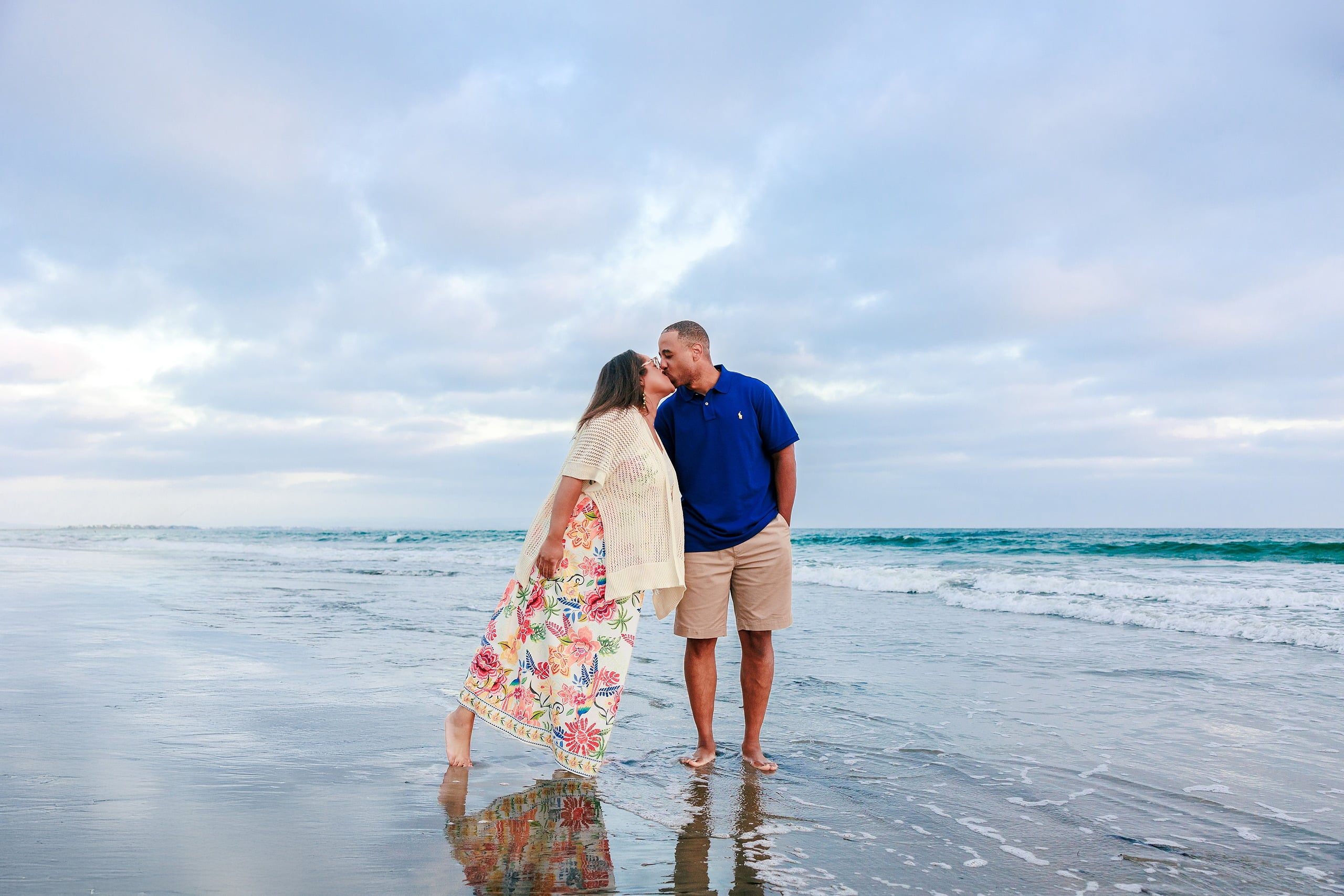 Because Time Flies: Family Photos on Coronado — 22 Michelle and Dion stand facing each other in the water at Coronado