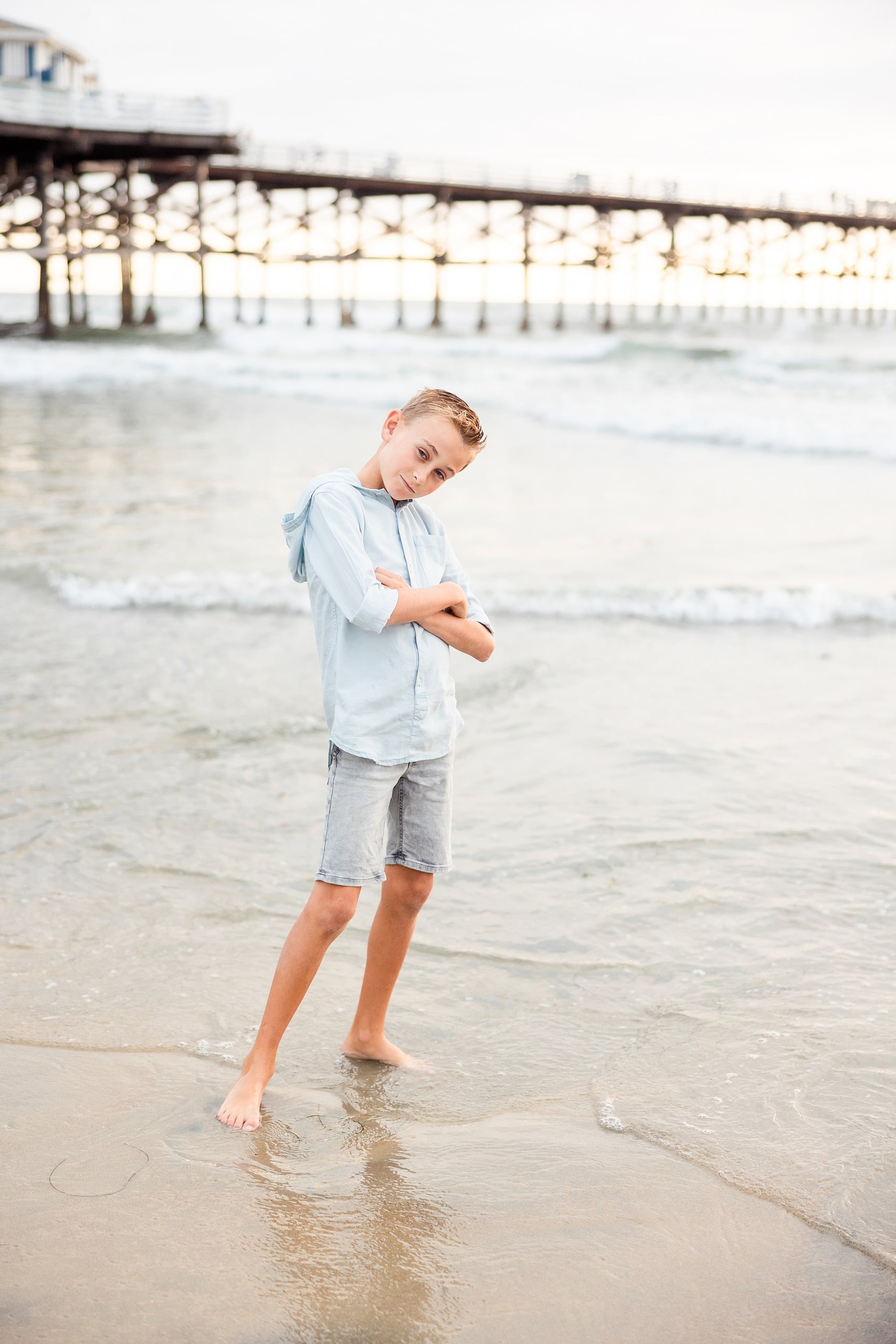 Butlers on the Beach — 16 Boy in light blue shirt standing in shallow water near Crystal Pier