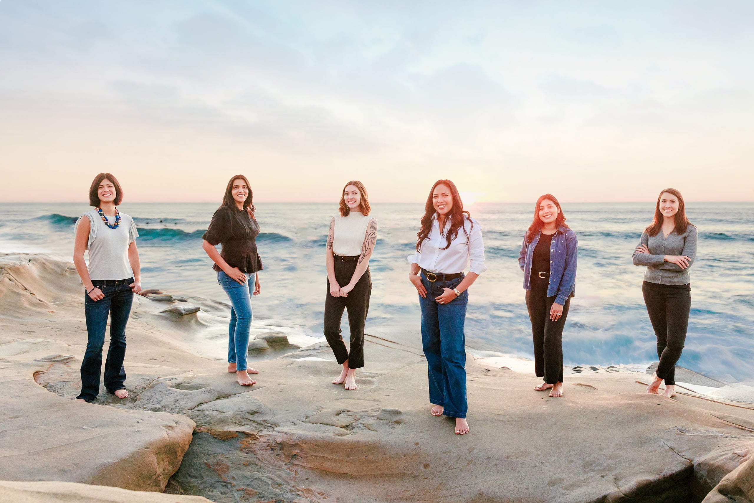 Capturing San Diego Spirit: Intention 2 Impact’s Team Retreat at Windansea — 33 Team of six standing on Windansea beach in golden light by ocean