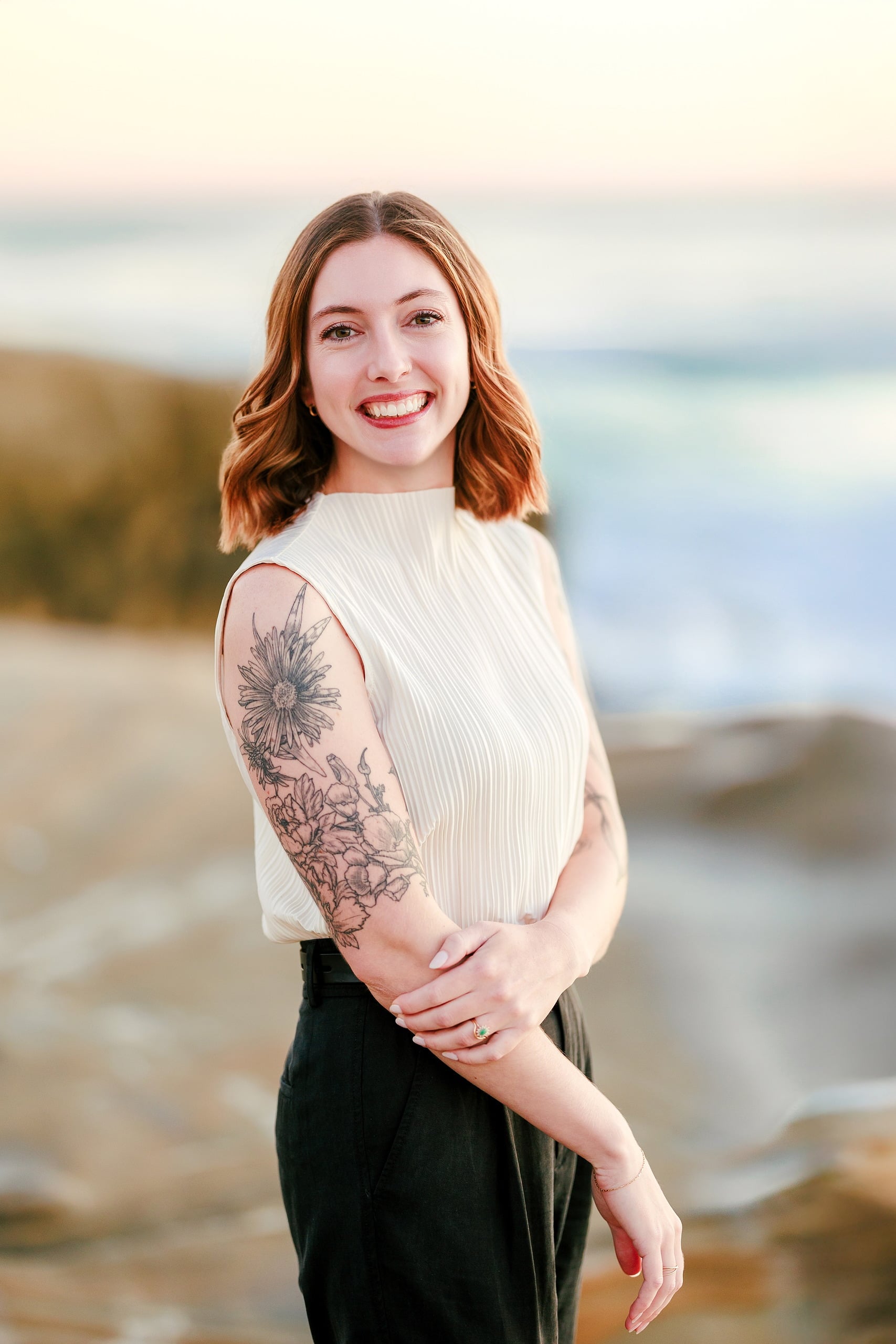 Capturing San Diego Spirit: Intention 2 Impact’s Team Retreat at Windansea — 35 Tattooed woman in white ribbed top standing on Windansea beach