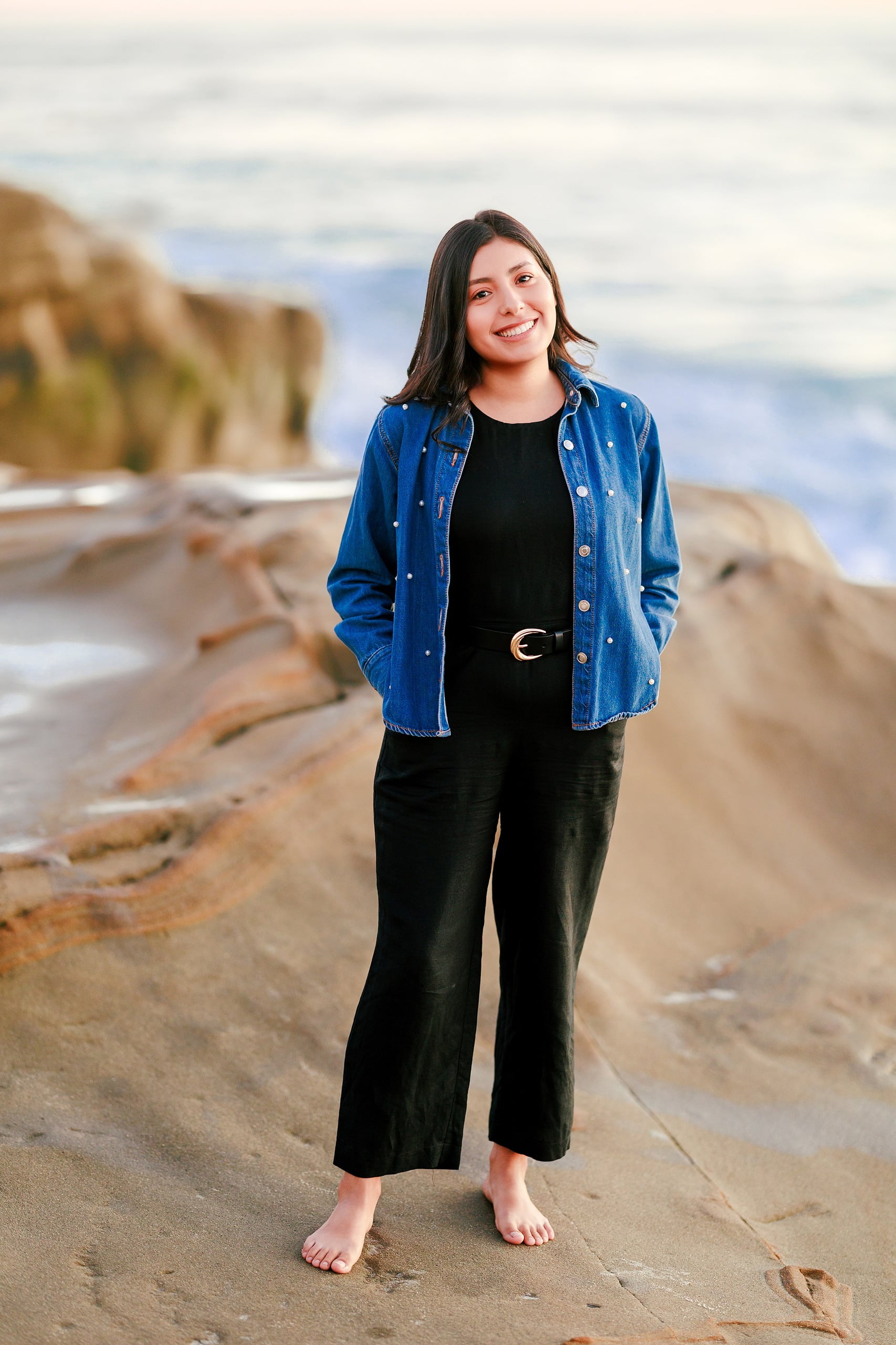 Capturing San Diego Spirit: Intention 2 Impact’s Team Retreat at Windansea — 38 Woman in denim jacket standing barefoot on Windansea beach at sunset