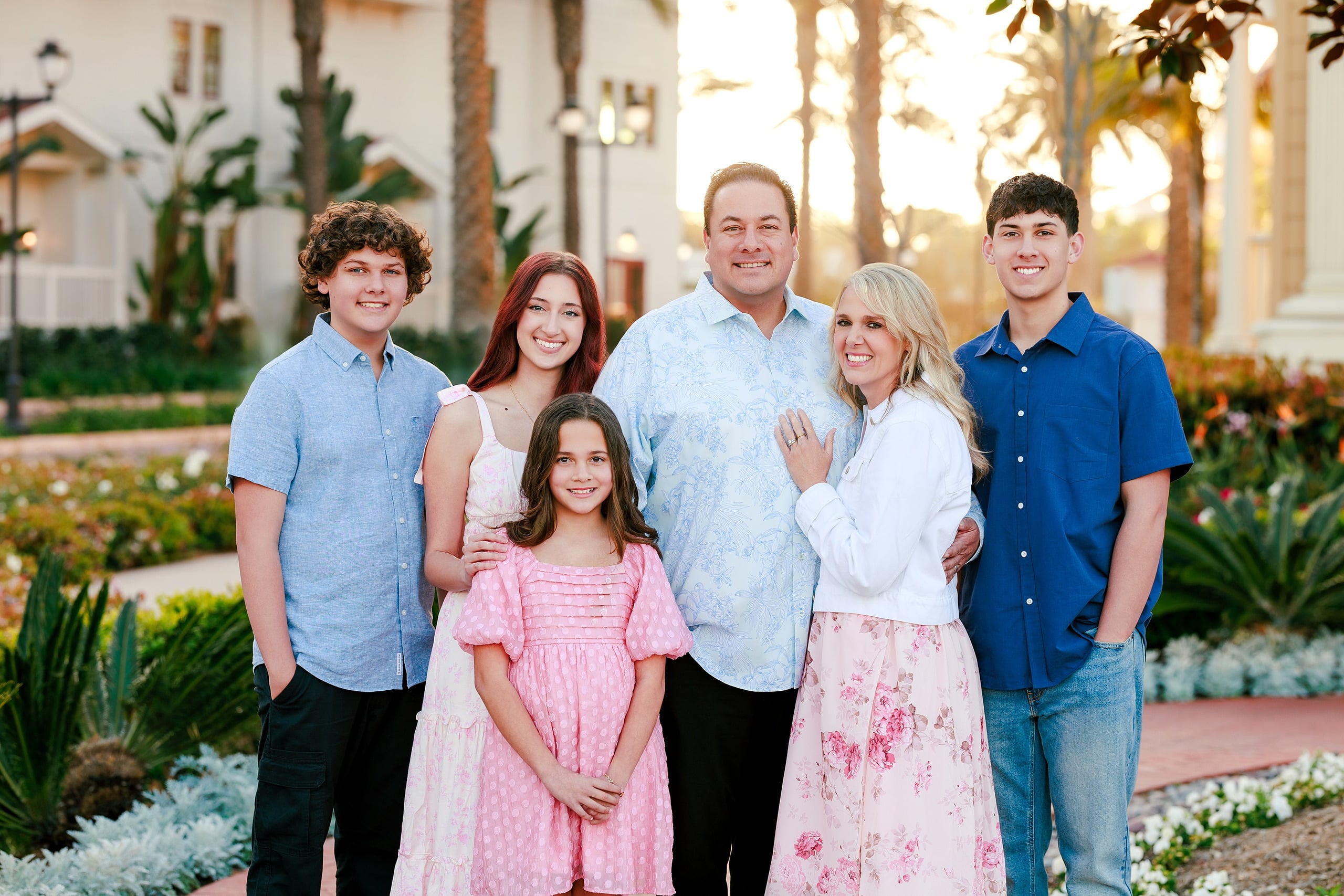 Coronado Beach Memories with the Sanchez Family — 01 Family of six standing at Hotel del Coronado with colorful flower garden