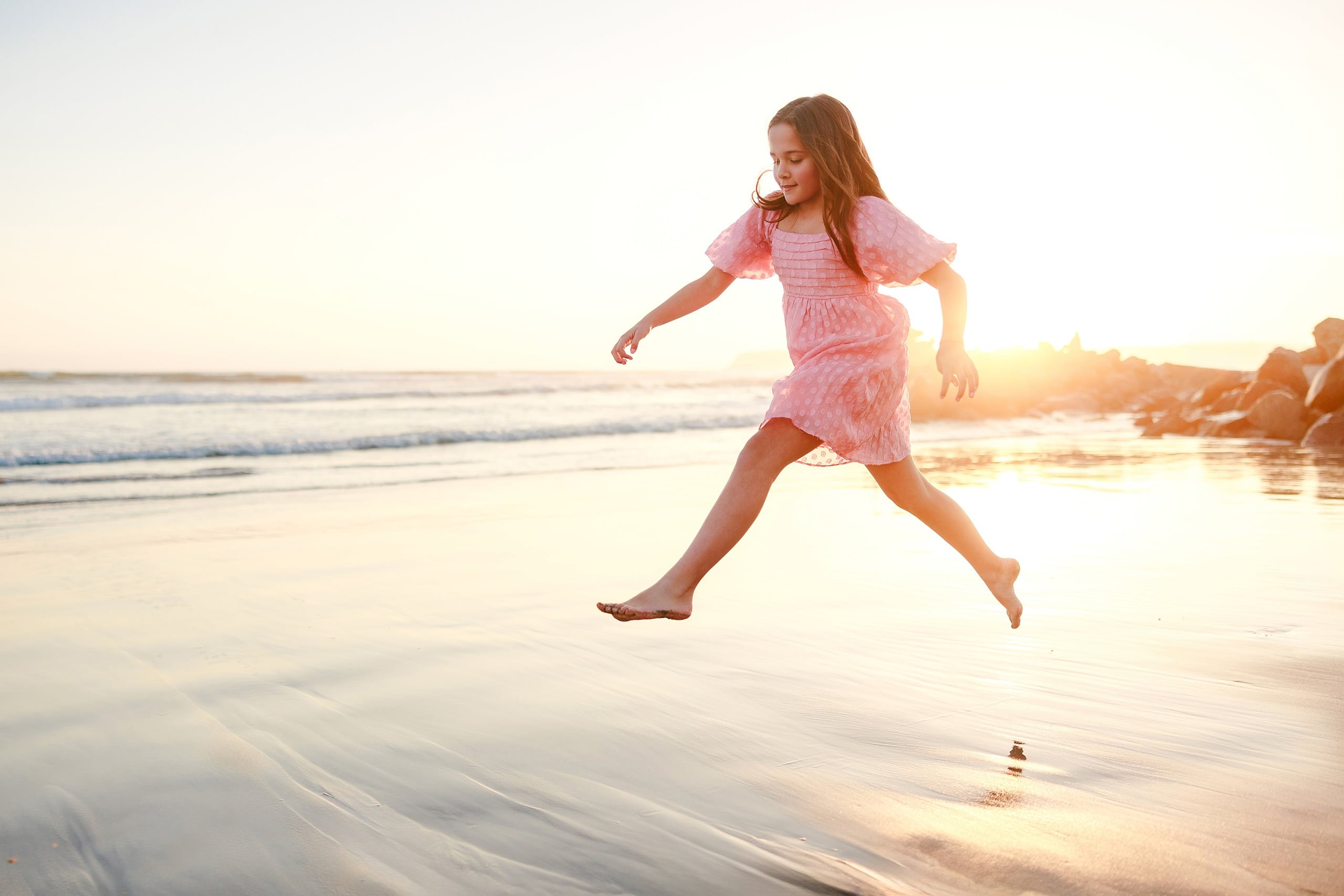 Coronado Beach Memories with the Sanchez Family — 12 Woman in pink sleeveless dress standing in shallow water on Coronado Beach