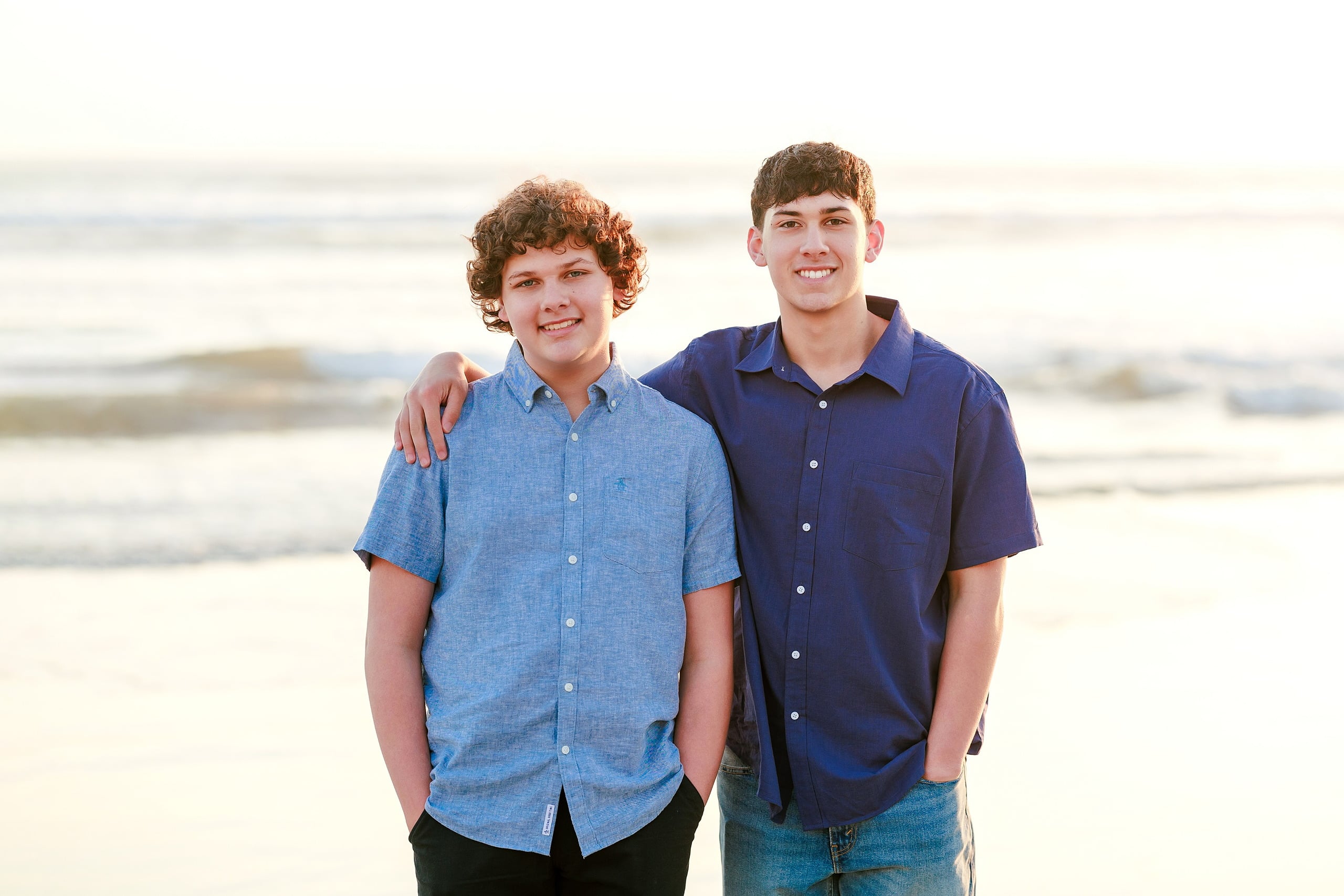 Coronado Beach Memories with the Sanchez Family — 16 Two teenage boys with arms around shoulders on Coronado Beach at sunset