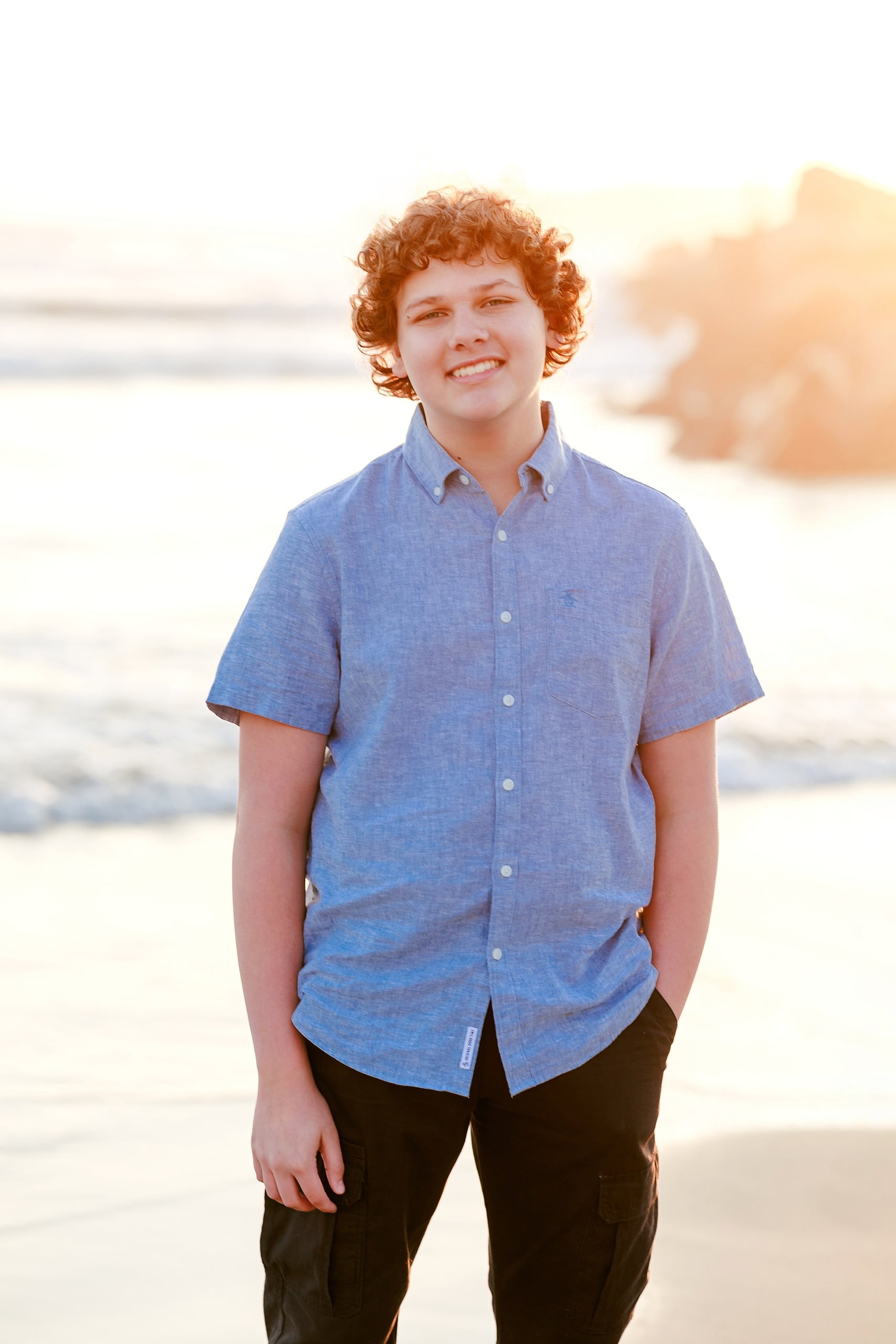 Coronado Beach Memories with the Sanchez Family — 17 Teenage girl in blue shirt smiling on Coronado Beach at golden hour