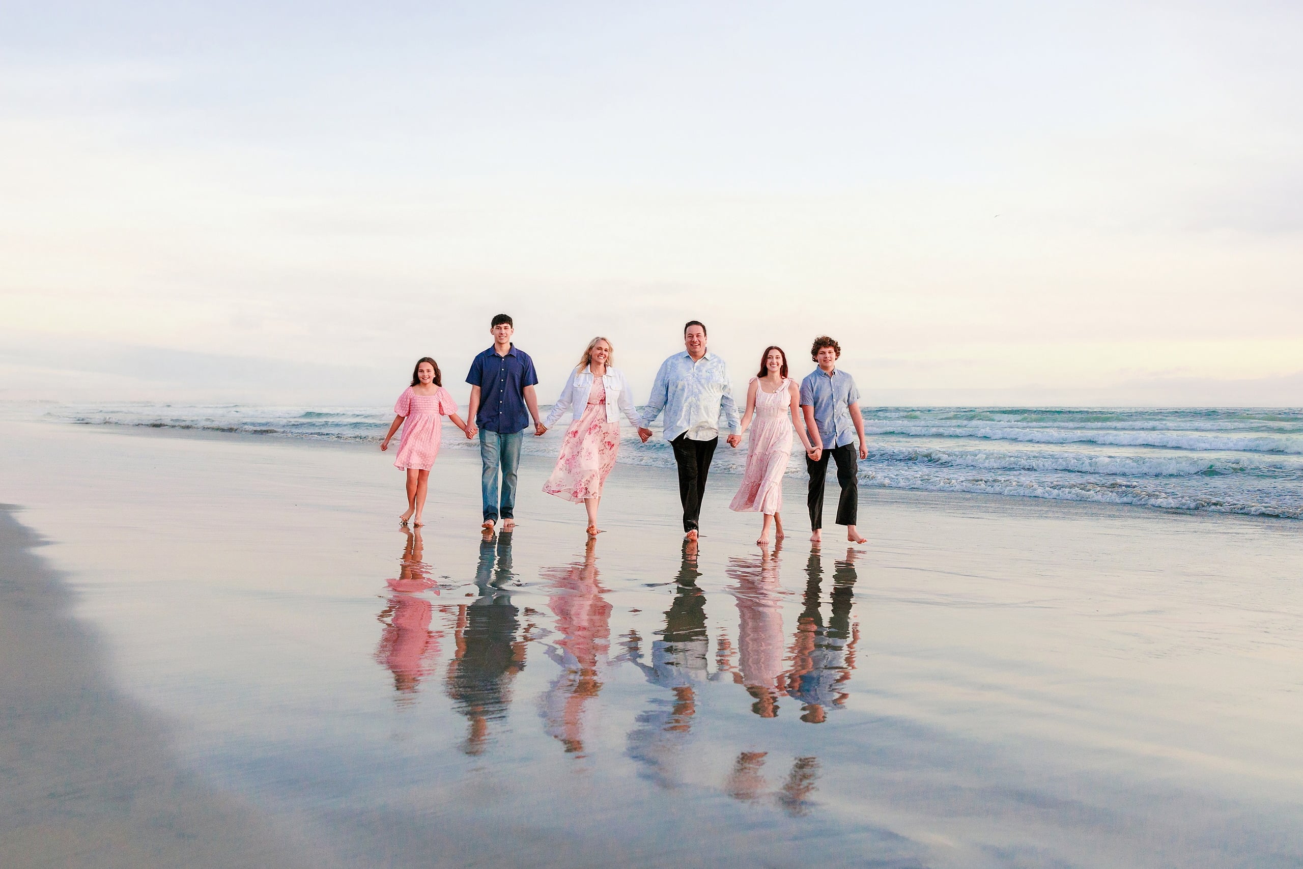 Coronado Beach Memories with the Sanchez Family — 26 Family holding hands walking through shallow water on Coronado Beach