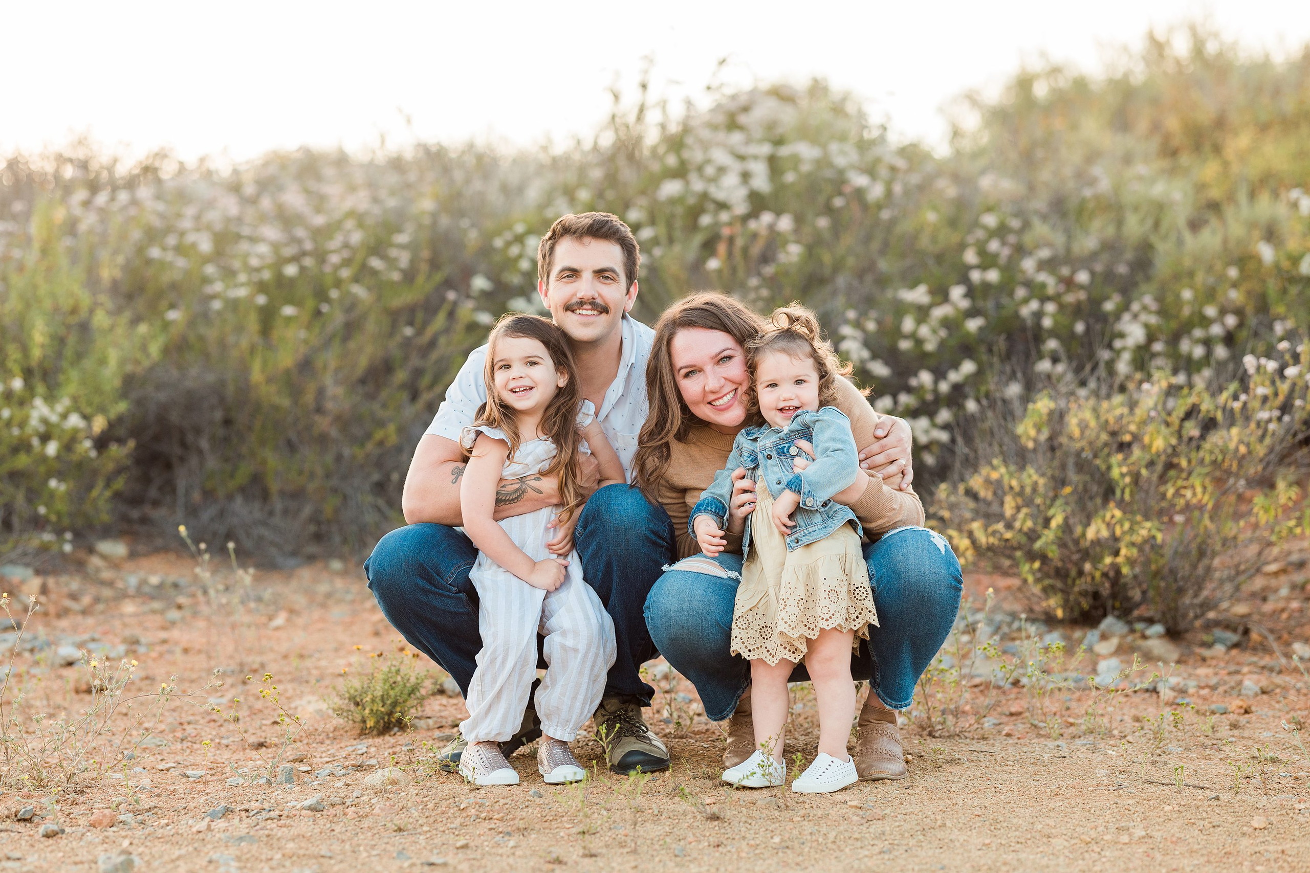 Dictionary Hill Nature Trails Family Photography in San Diego — 06 Family of four standing together on sandy ground at Dictionary Hill