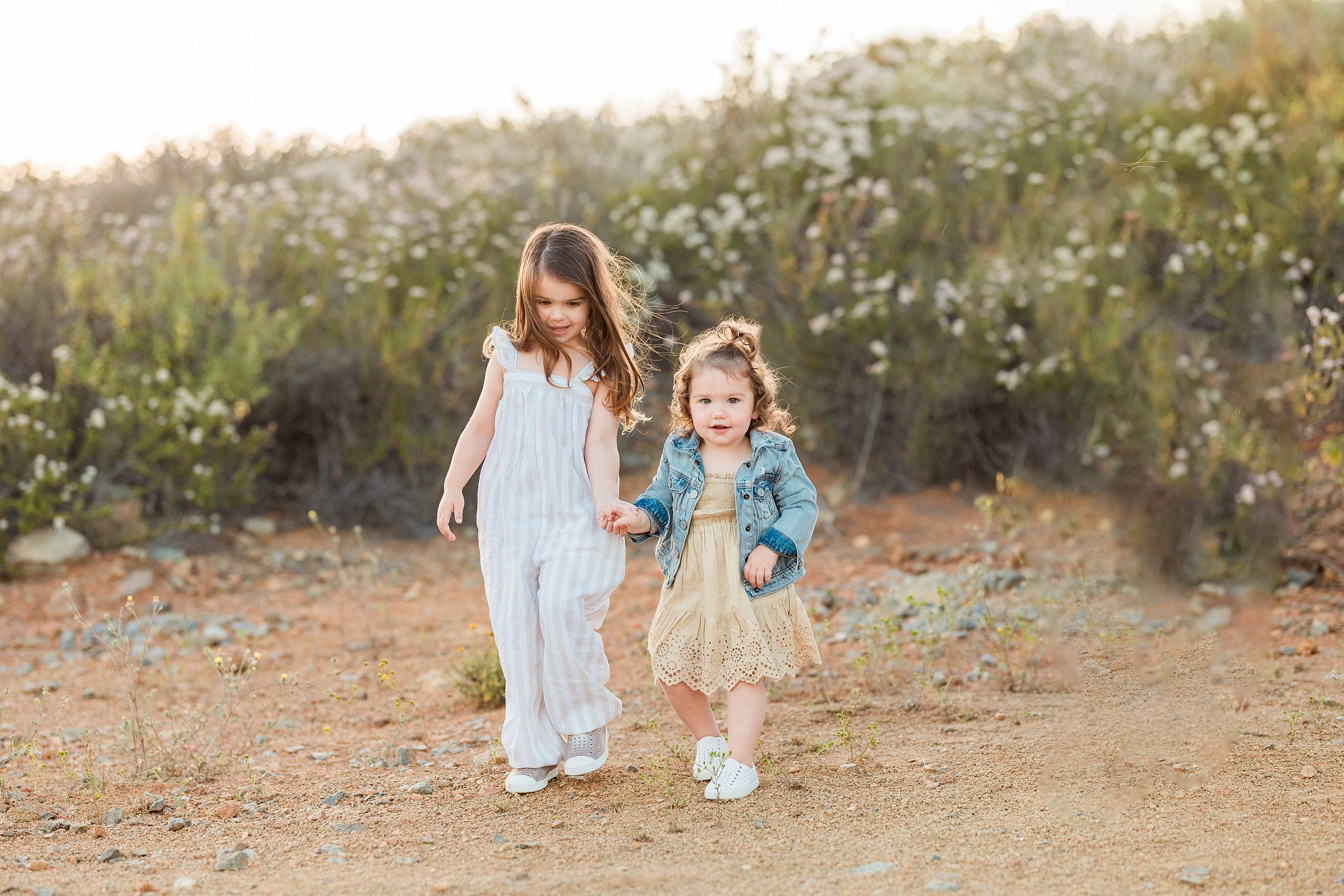 Dictionary Hill Nature Trails Family Photography in San Diego — 07 Two children holding hands walking on trail at Dictionary Hill