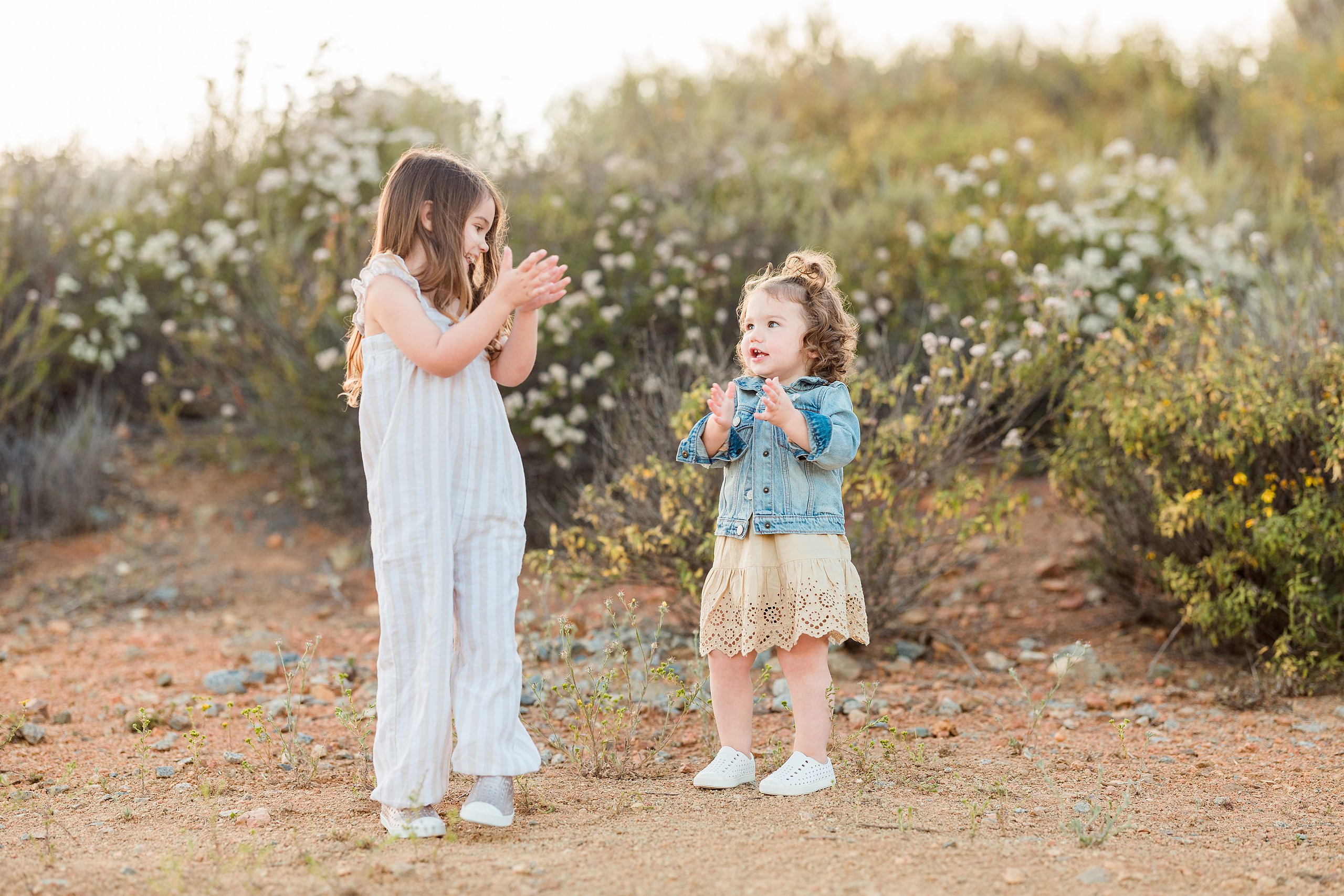 Dictionary Hill Nature Trails Family Photography in San Diego — 09 Two children hand-in-hand on the flowering Dictionary Hill trail