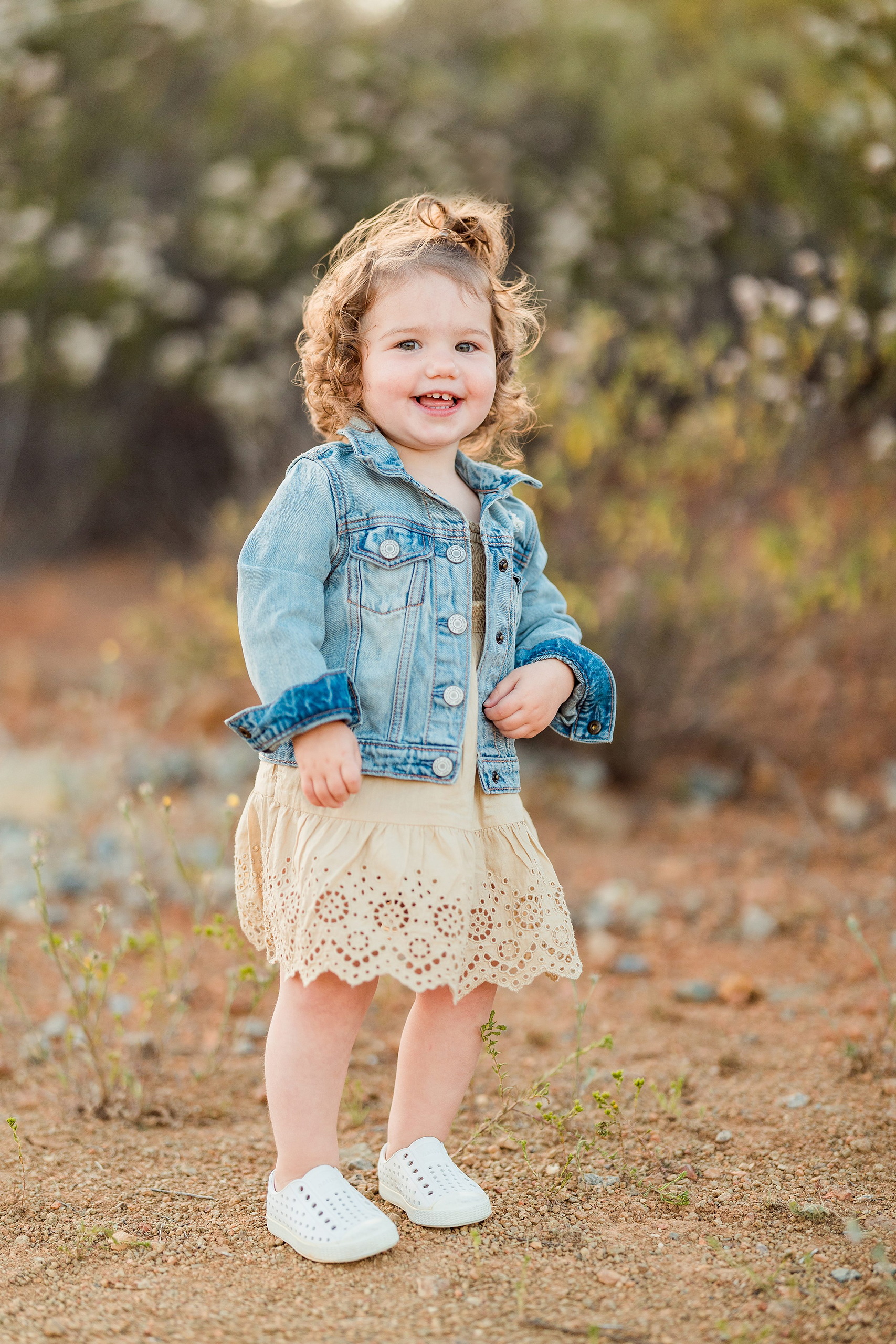 Dictionary Hill Nature Trails Family Photography in San Diego — 10 Toddler in denim jacket standing on sandy ground at Dictionary Hill