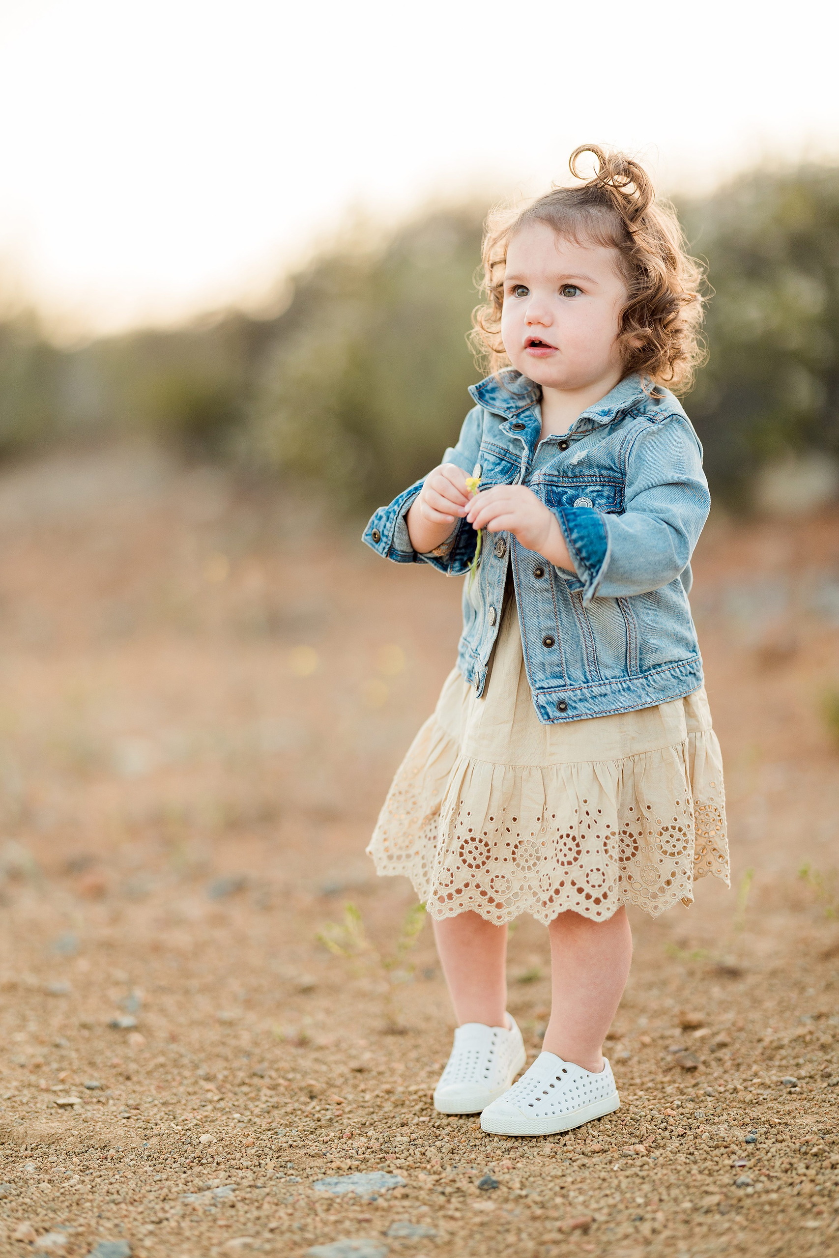 Dictionary Hill Nature Trails Family Photography in San Diego — 14 Toddler in denim jacket standing with hands at sides on Dictionary Hill