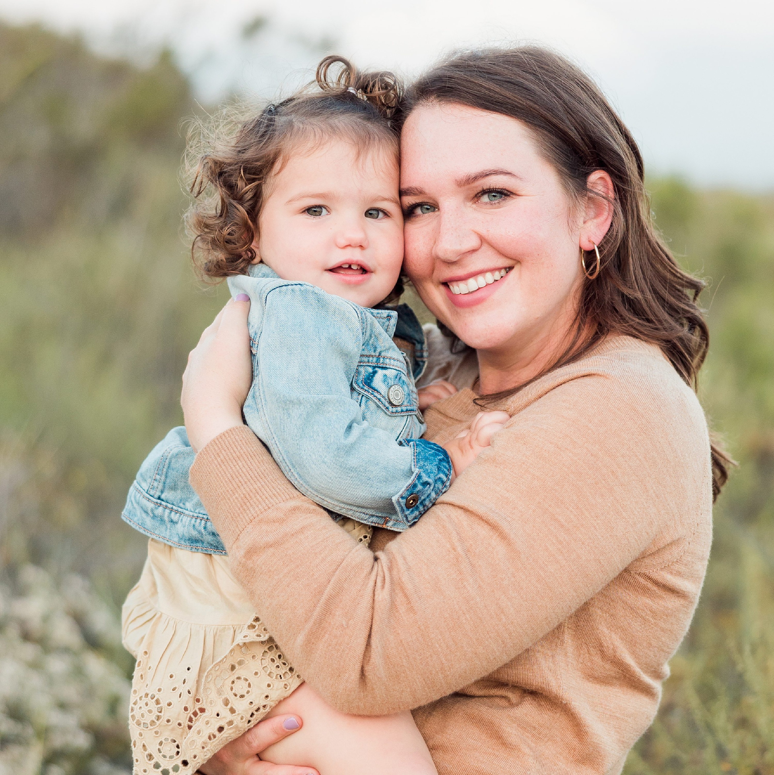 Dictionary Hill Nature Trails Family Photography in San Diego — 53 Woman holding toddler close for portrait at Dictionary Hill