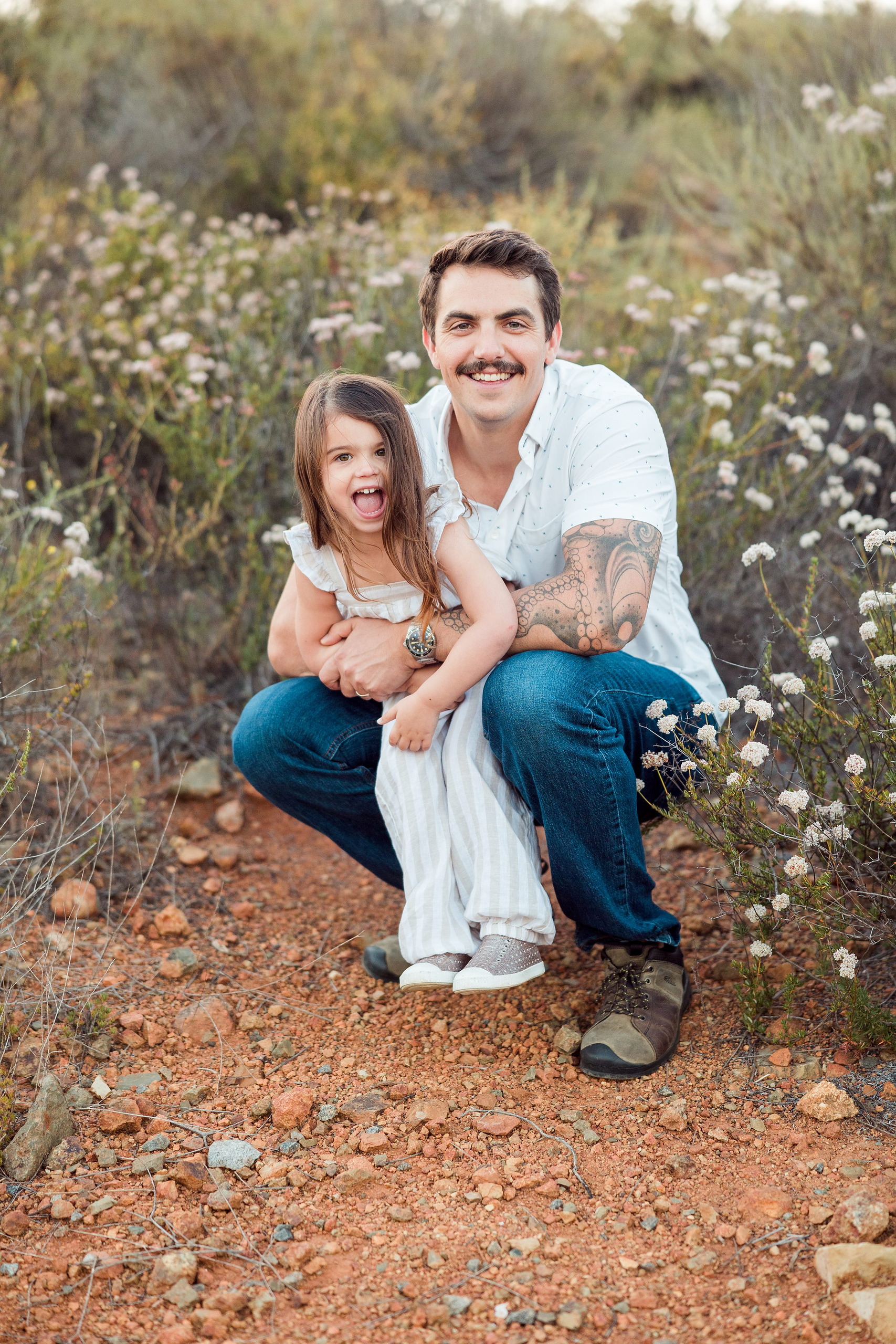 Dictionary Hill Nature Trails Family Photography in San Diego — 55 Father and child crouching together at Dictionary Hill Nature Trails