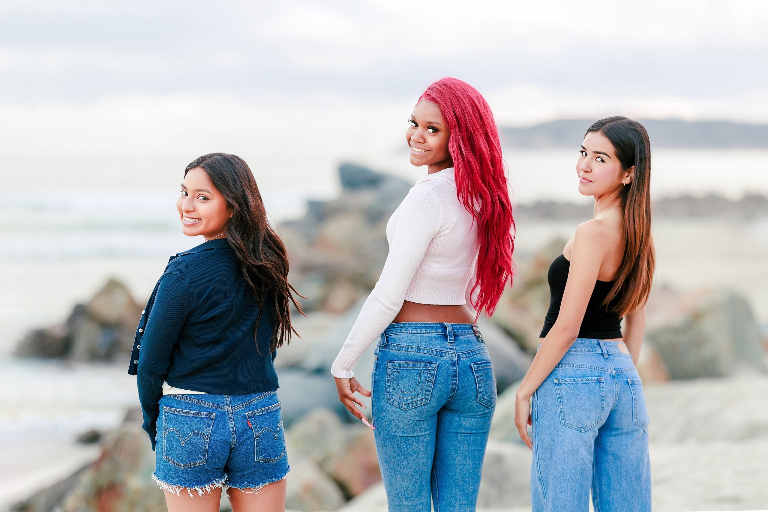 Evanna, Atalia, and Erleen’s Senior Session on Coronado — 23 Three seniors standing together on beach with rocks and water