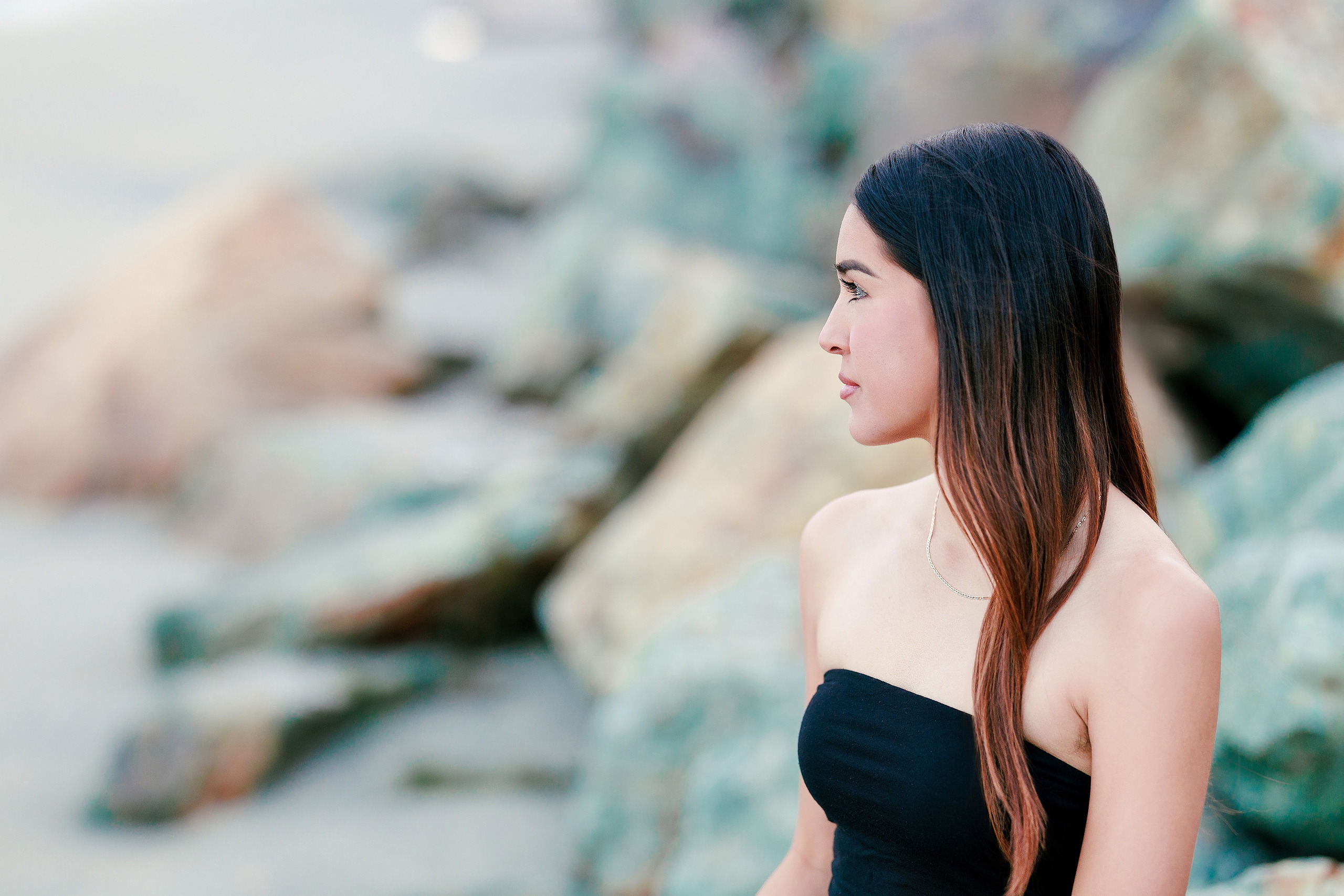 Evanna, Atalia, and Erleen’s Senior Session on Coronado — 25 Senior in navy cardigan in profile on pier at Coronado beach
