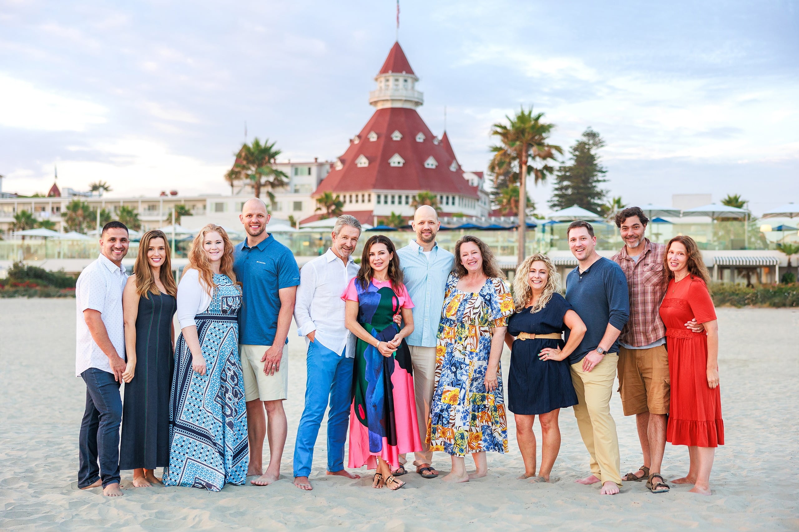 Extended Family Photography Hotel Del Coronado — 08 Extended family members line up on sand with Hotel del Coronado in background