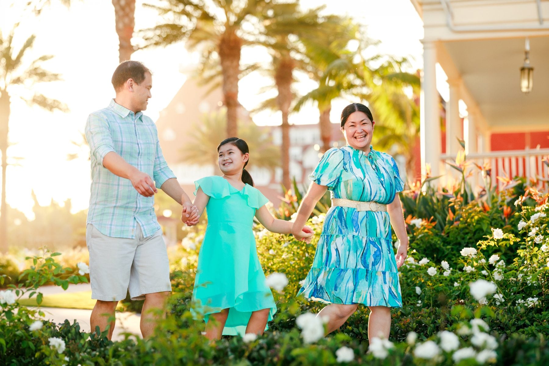 San Diego family walks hand in hand through blooming garden path