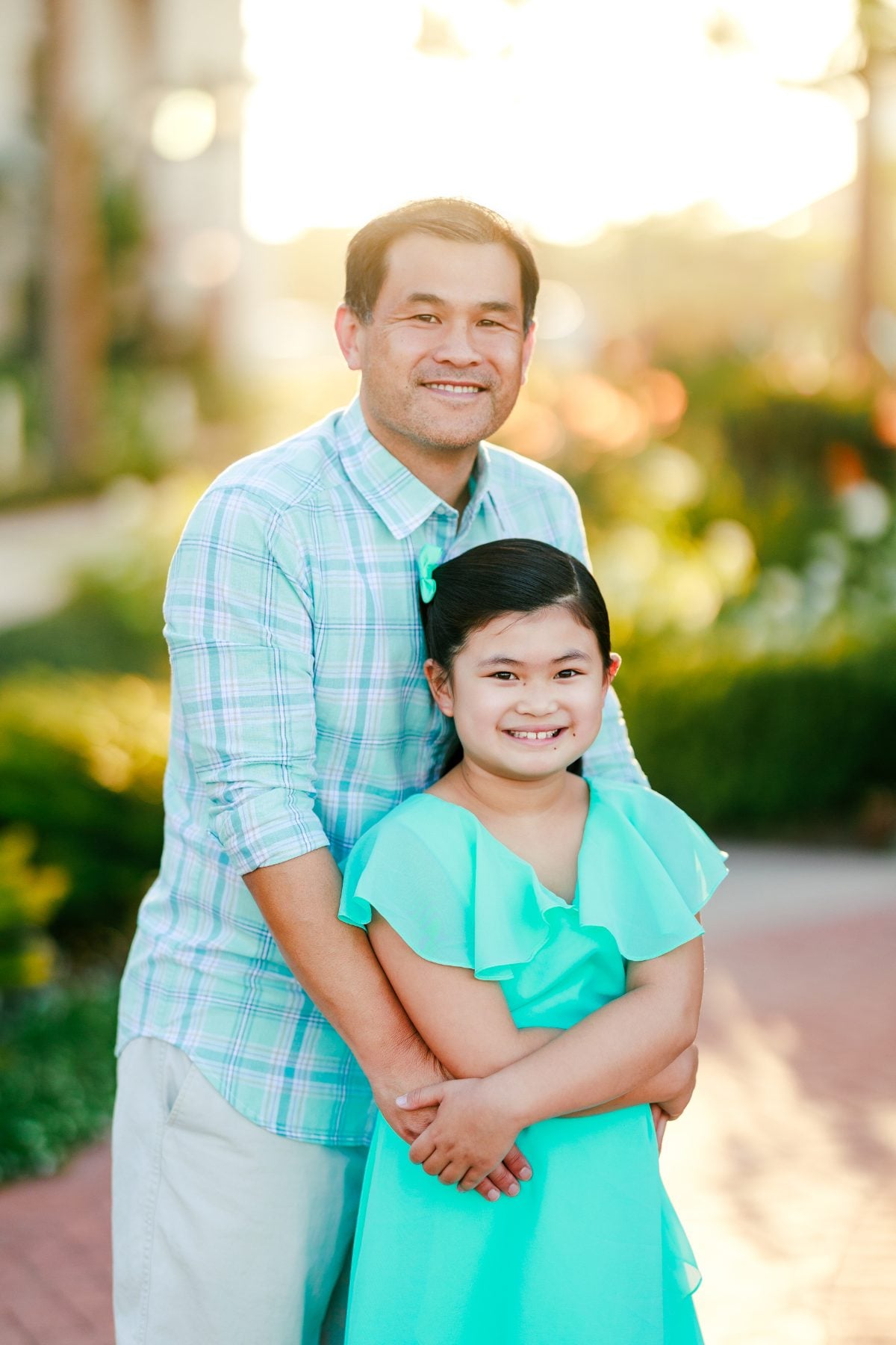 Father and daughter pose together for San Diego family photographer session
