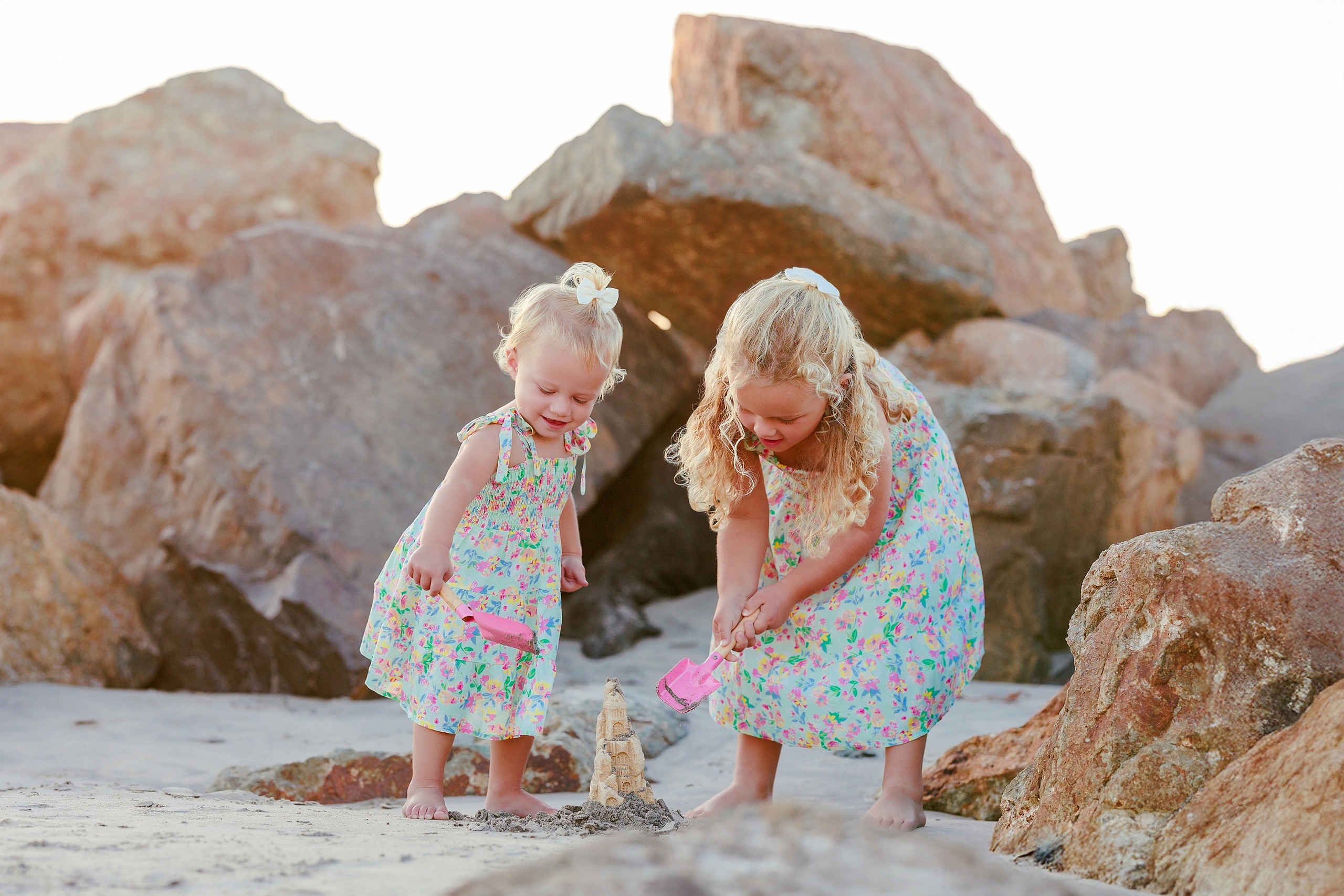 Hotel del Coronado Family Photos — 08 Mabel standing alone on Coronado beach at golden hour in her floral dress