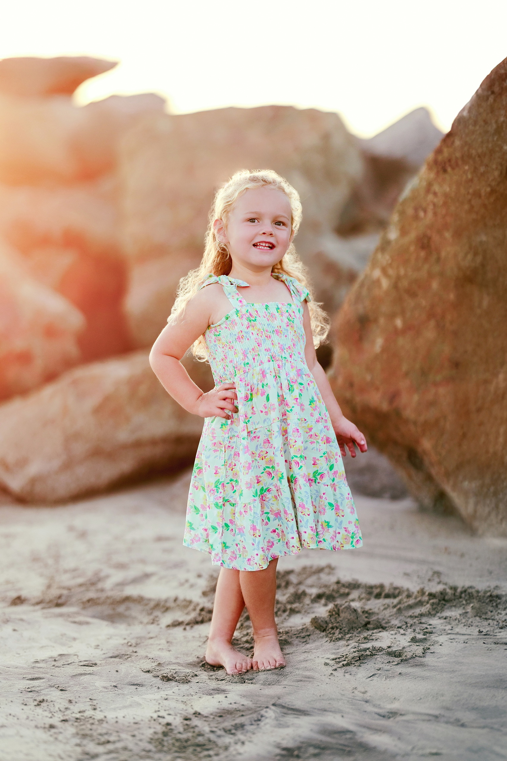 Hotel del Coronado Family Photos — 10 Mabel with open arms on Coronado beach during golden hour light